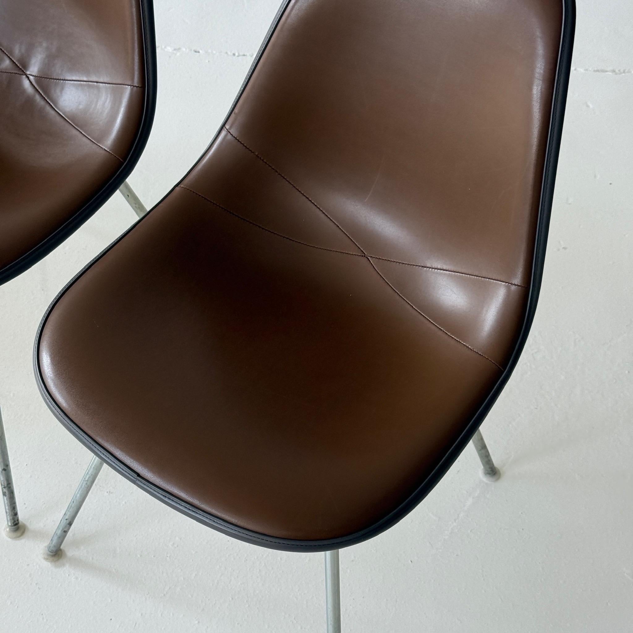 c. 1970s. USA. Price is for the set. Contact us if you’d like to purchase a single item. Vinyl upholstered shell chairs. 

