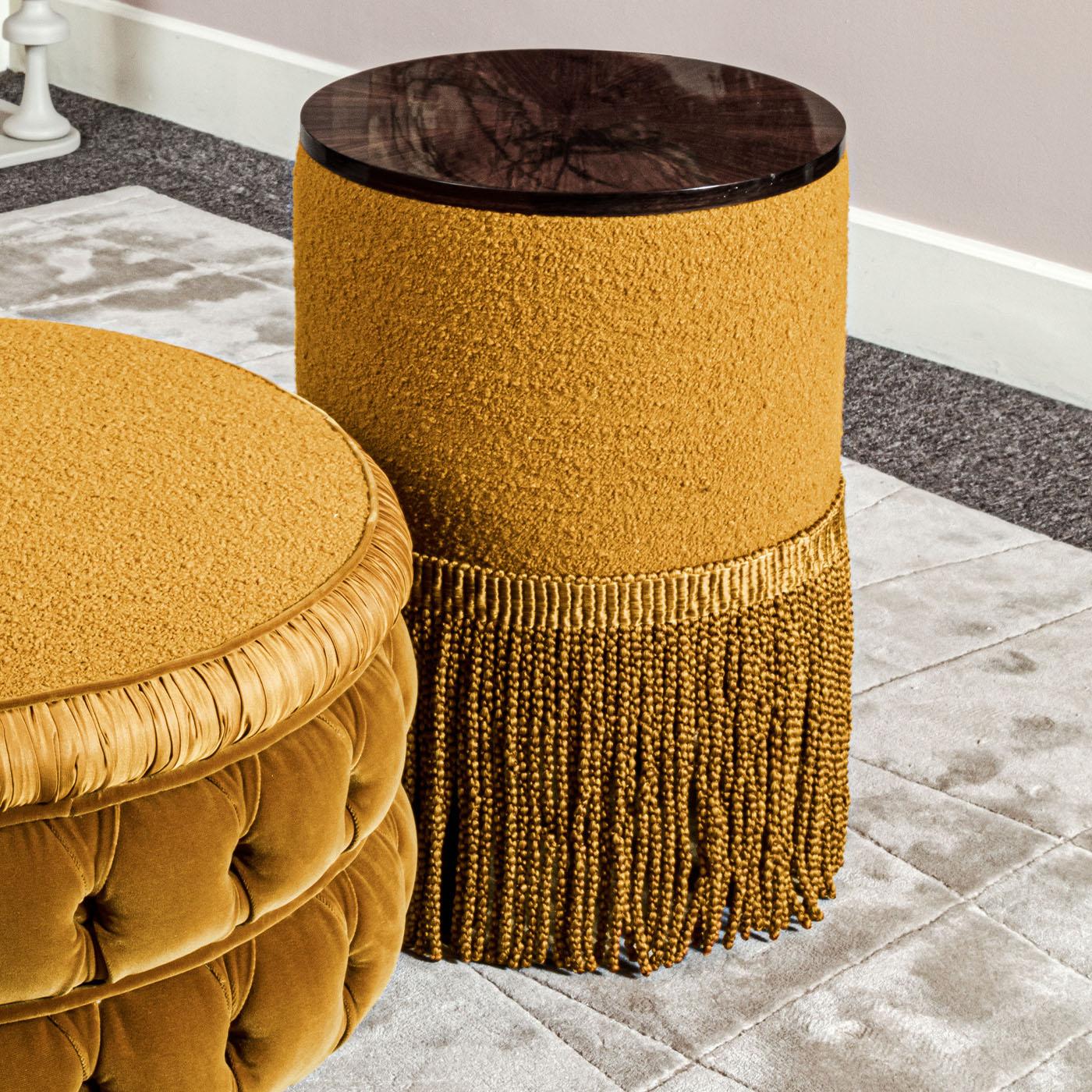 This handcrafted upholstered side table, with a wooden top and an ochre color, exudes charm and versatility, making it a delightful addition to any room.