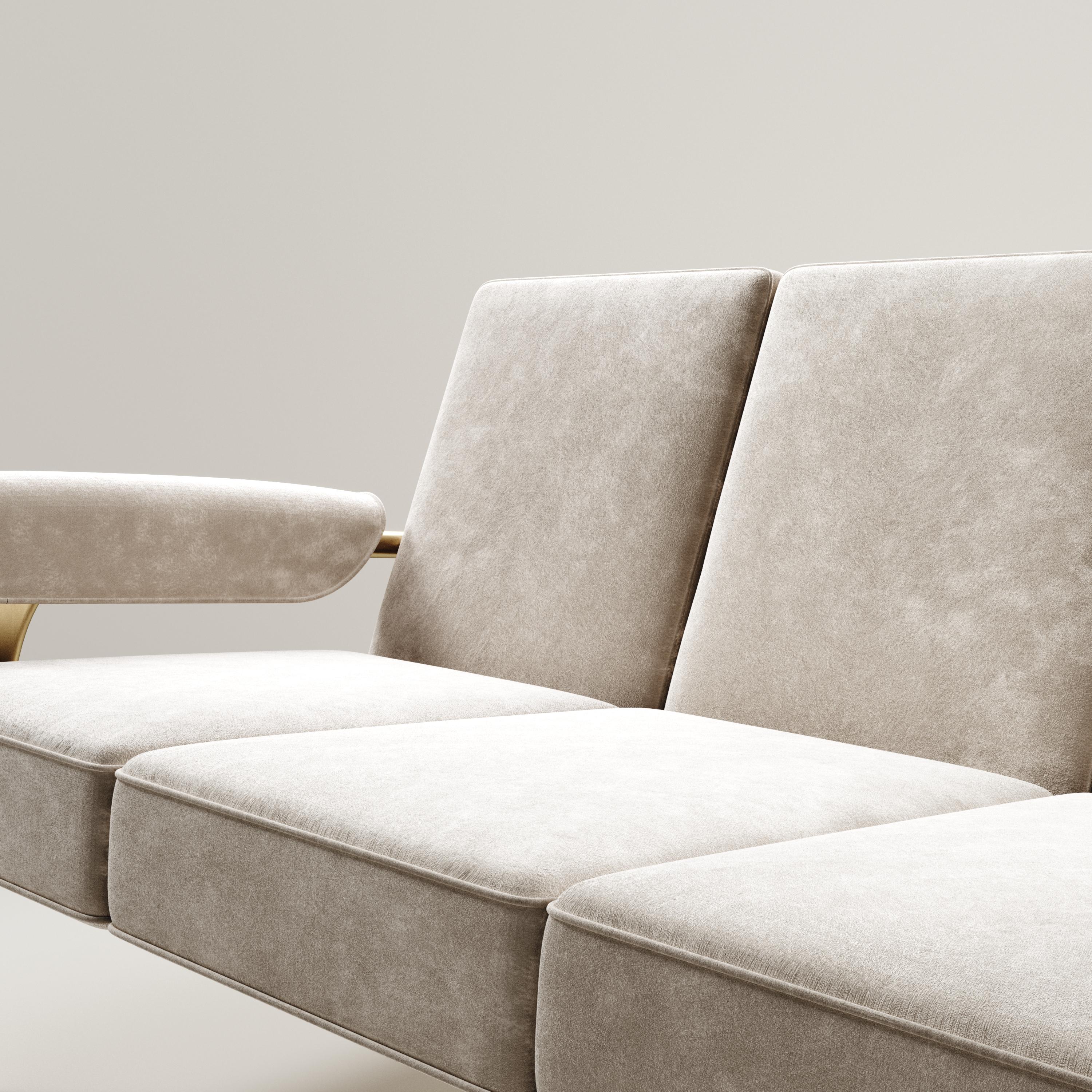 The Ramo sofa by R & Y Augousti is an elegant and versatile piece. The upholstered pieces provide comfort while retaining a unique aesthetic with the bronze-patina brass frame and details. This listing is priced for cream velvet, see other listings
