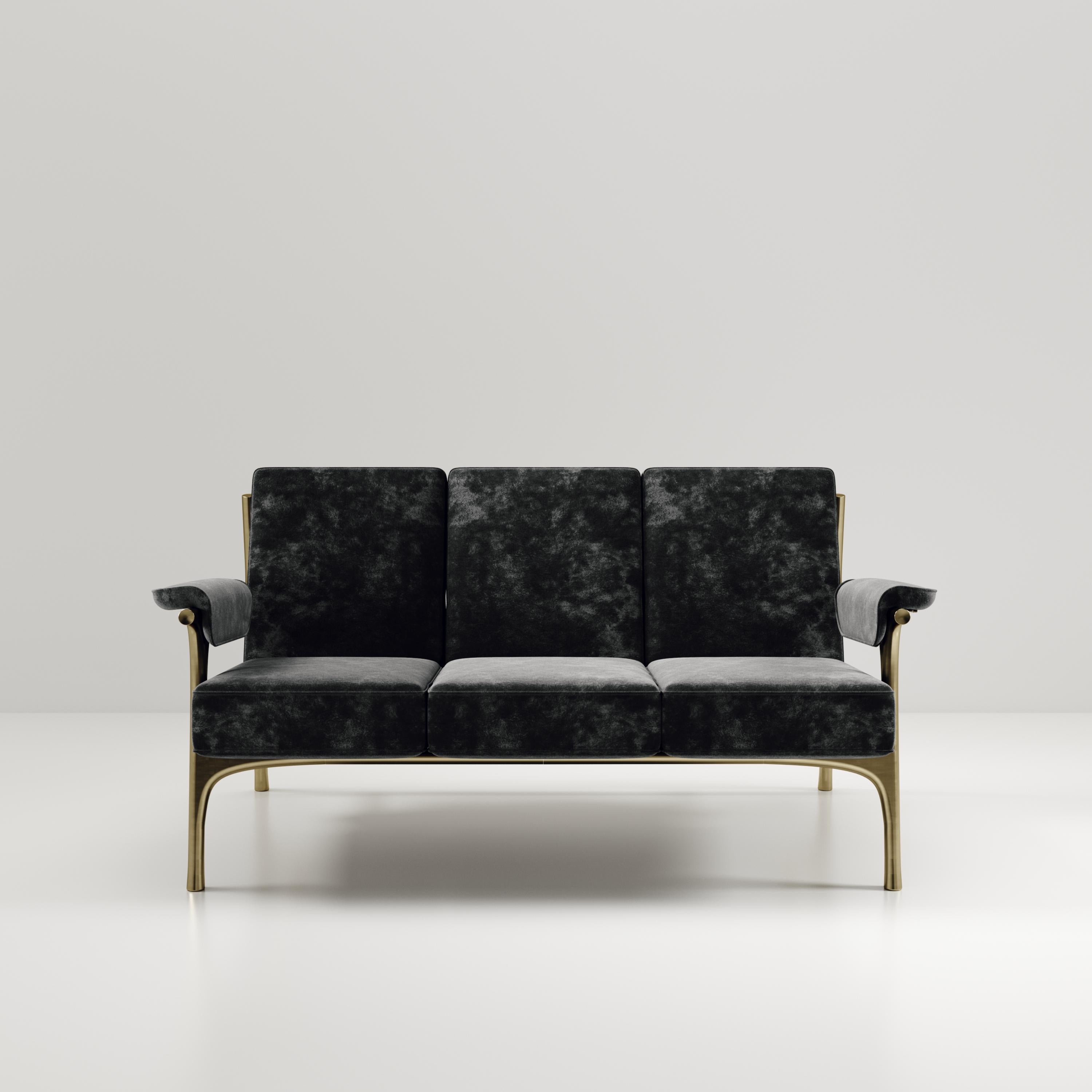 The Ramo sofa by R & Y Augousti is an elegant and versatile piece. The upholstered pieces provide comfort while retaining a unique aesthetic with the bronze-patina brass frame and details. This listing is priced for black velvet, see other listings