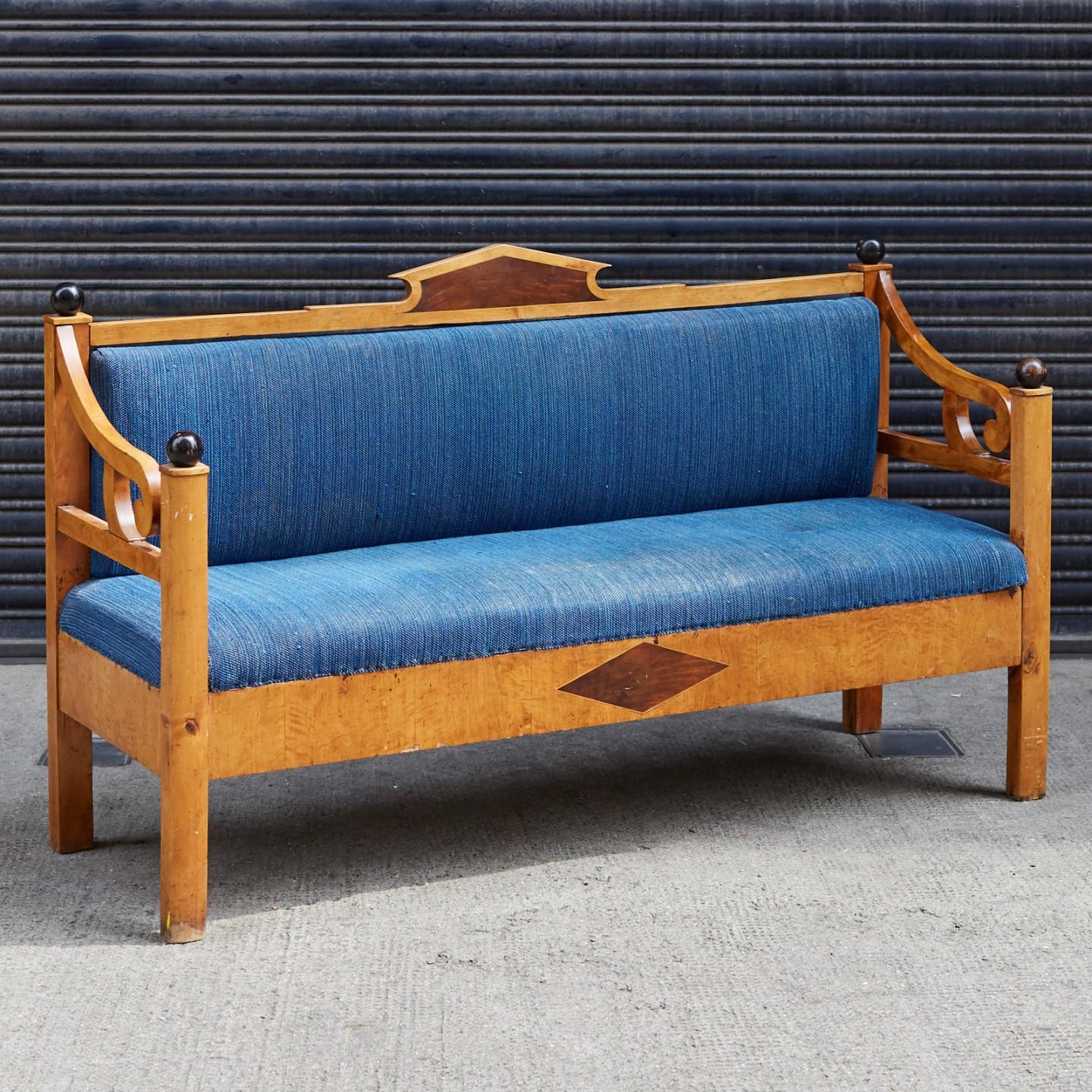 A maple Swedish bench, with dyed indigo upholstery and walnut inlay.