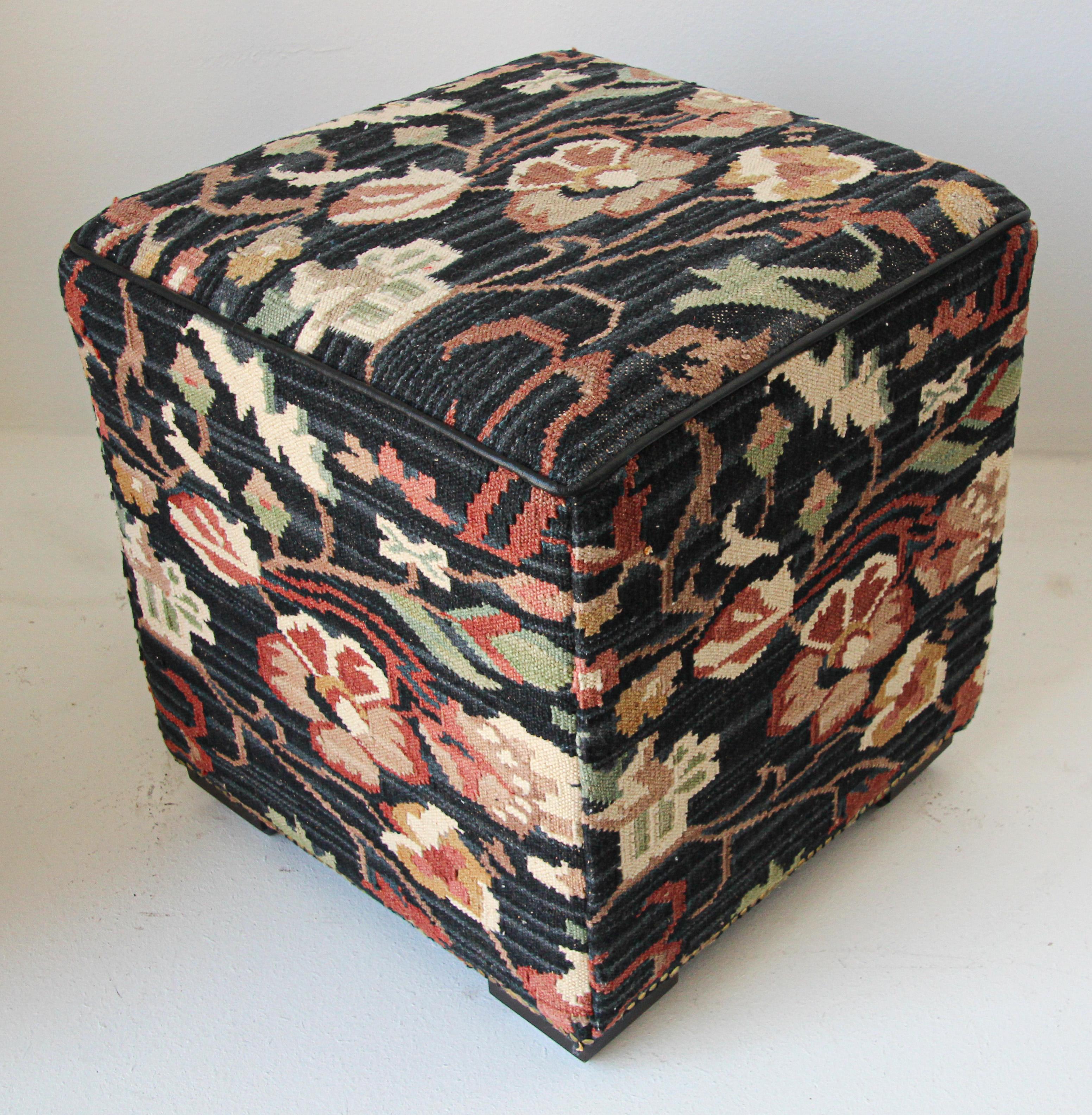 Handcrafted Turkish kilim ottoman, square hassock, upholstered with kilim rug fabric textured in black with floral design.
Moroccan style little tufted square pouf hassock, upholstered footstool.
This versatile accent piece, pouf is designed