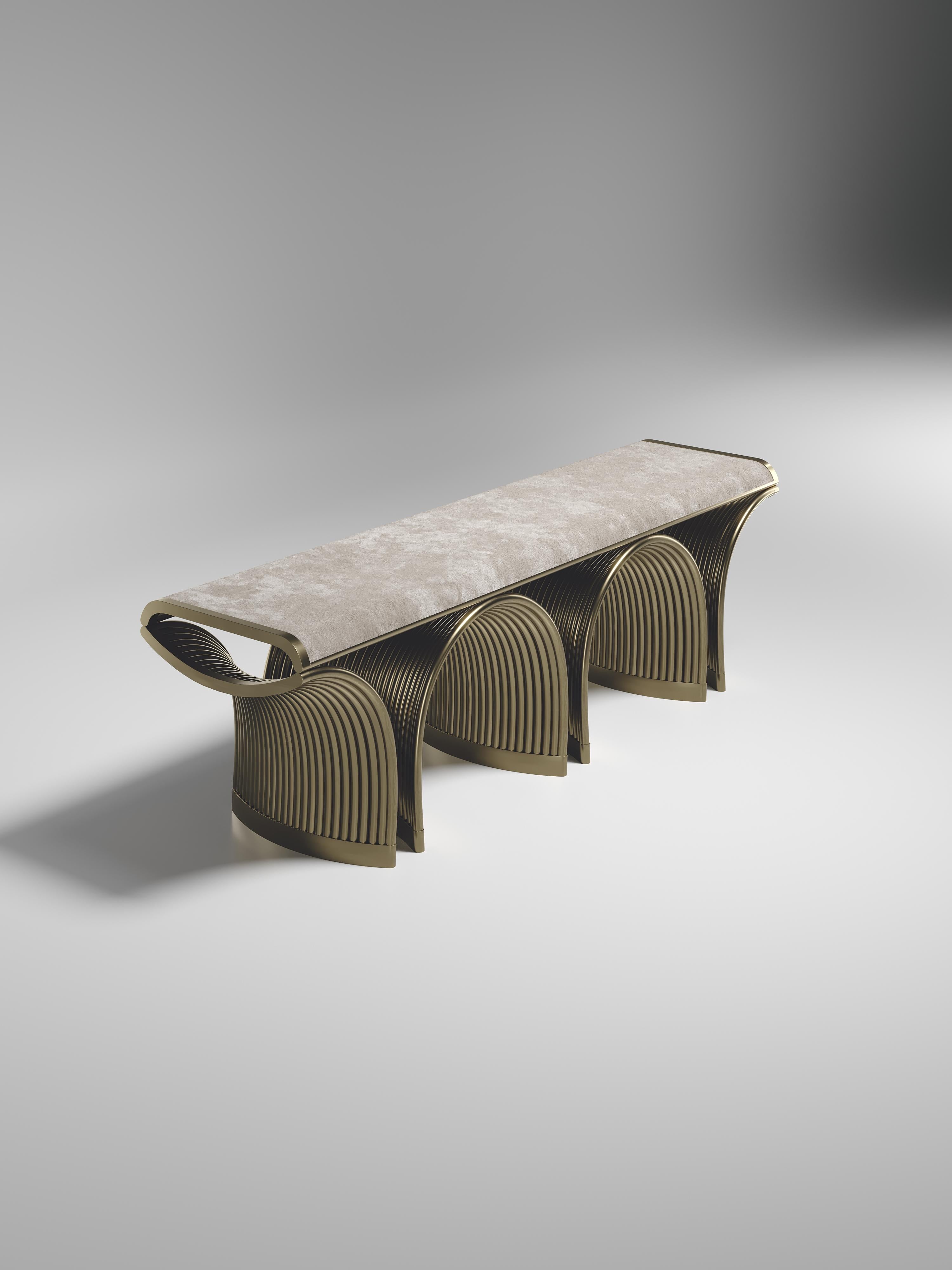 The Nymphea bench by R&Y Augousti upholstered in cream velvet with bronze-patina brass details explores the brand's iconic DNA of bringing old world artisanal craft into a contemporary and utterly luxury feel. The base of the bench is handcrafted