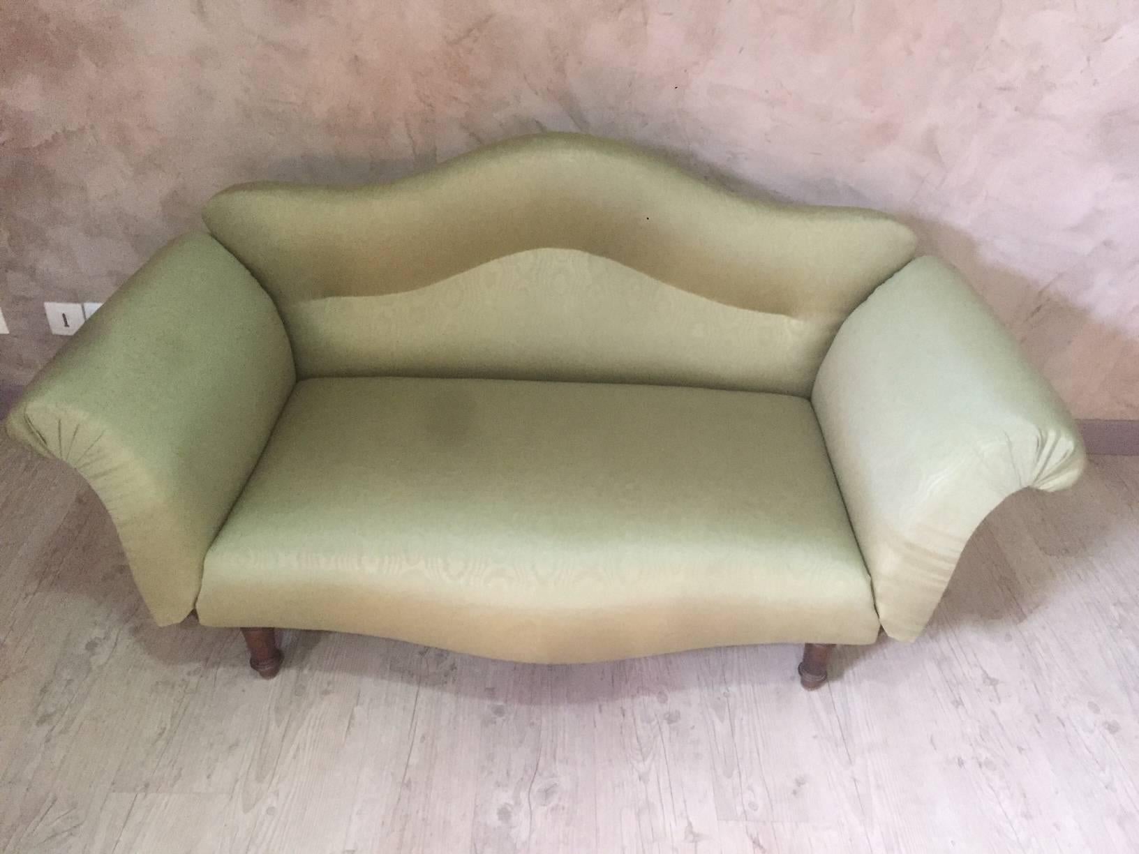 Very nice Napoleon III couch entirely upholstered with a green fabric.
 