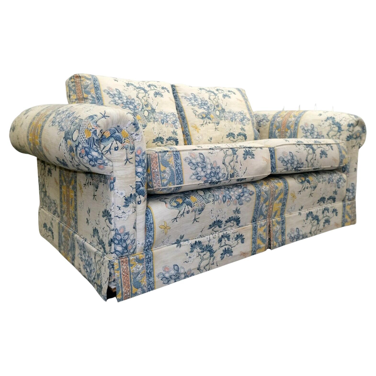 We are delighted to offer for sale this elegant floral sofa with roll arms and reversible cushions.

This well-made upholsterd sofa, by Ashley Lawrence, is in very good condition. The seat cushions are foam filled still having the comfy feeling,