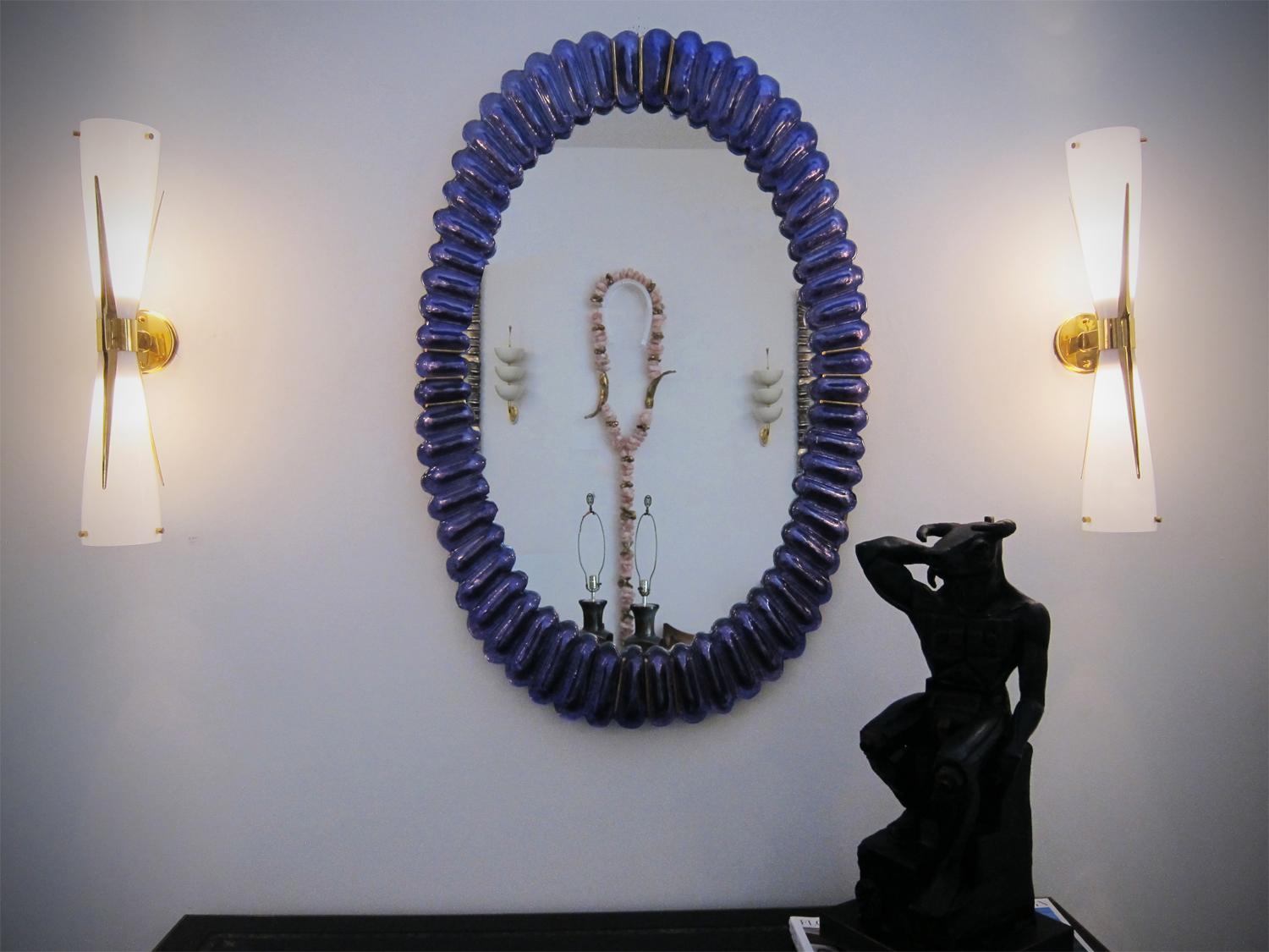 Uplight and downlight double-cone sconces
White Murano glass mounted on solid brass fixture
Allow light to pour out up and down
Add a dramatic and scenographic presence to any space
Wired to the American Standard
Located in our store in Miami
