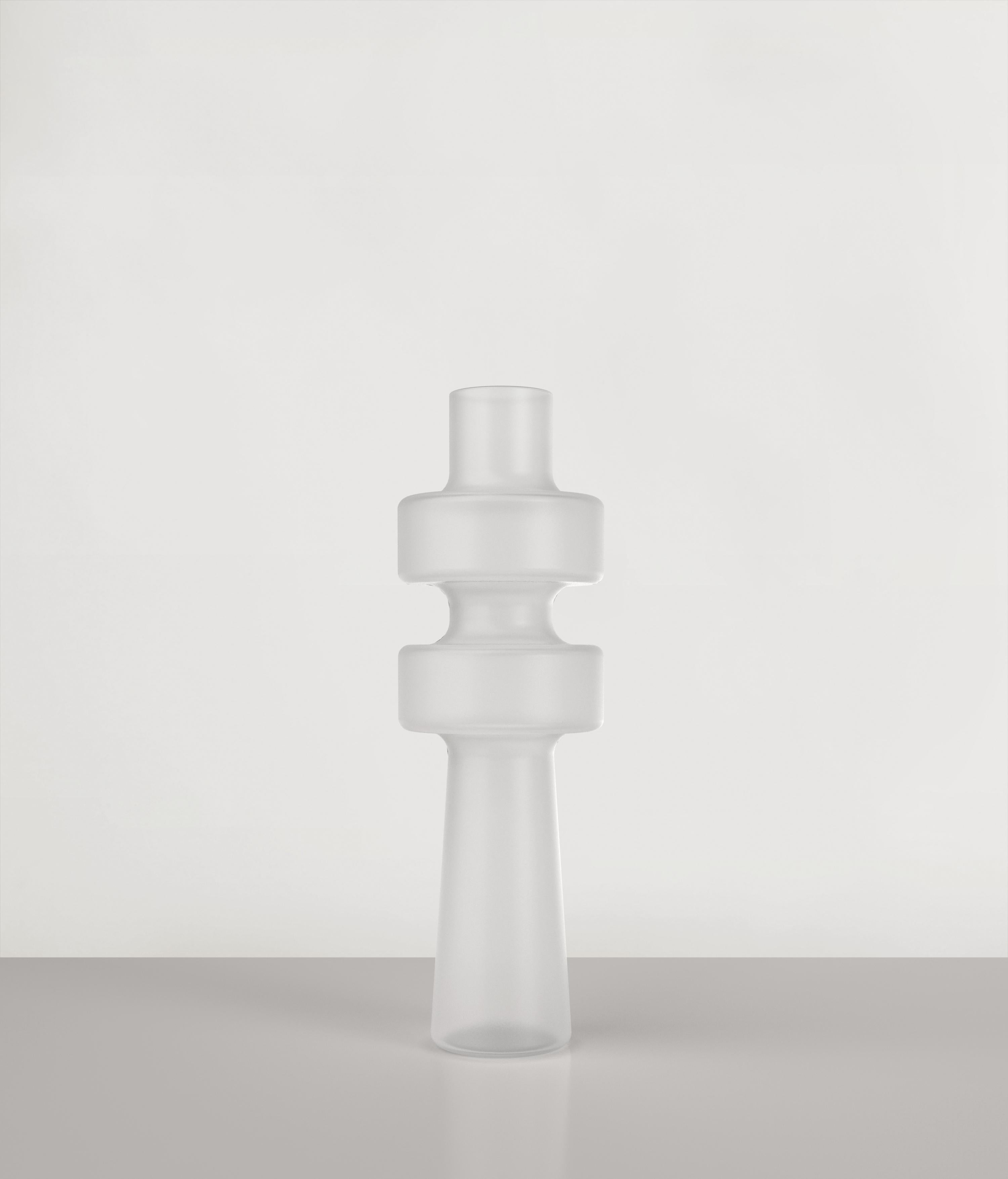 Uppa V1 Vase by Edizione Limitata
Limited Edition of 1000 pieces. Signed and numbered.
Dimensions: D12 x H38 cm
Materials: Sanded Glass

Uppa is a series of 21st Century sculptural vases made by Italian artisans in blown sanded glass. The piece is