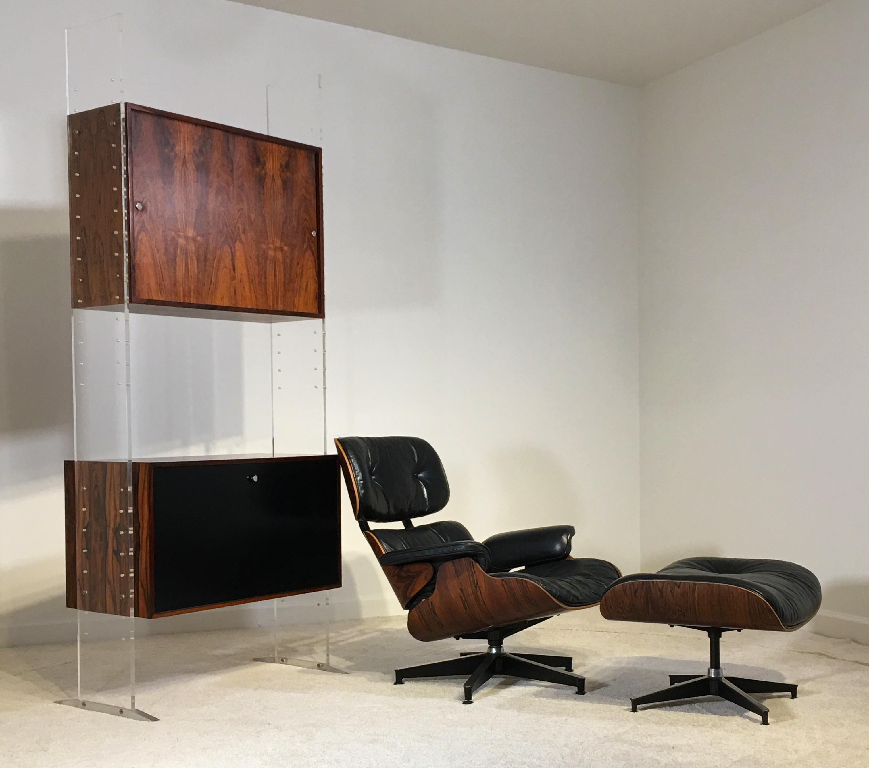 Poul Nørreklit, , Georg Petersens Møbelfabrik, Denmark,  circa 1969
Acrylic, steel, Brazilian Rosewood, lacquer,  Measures: 82.5 tall x 16 deep and 35 inches wide

A substantial and bold executive upright storage system with optional dividers