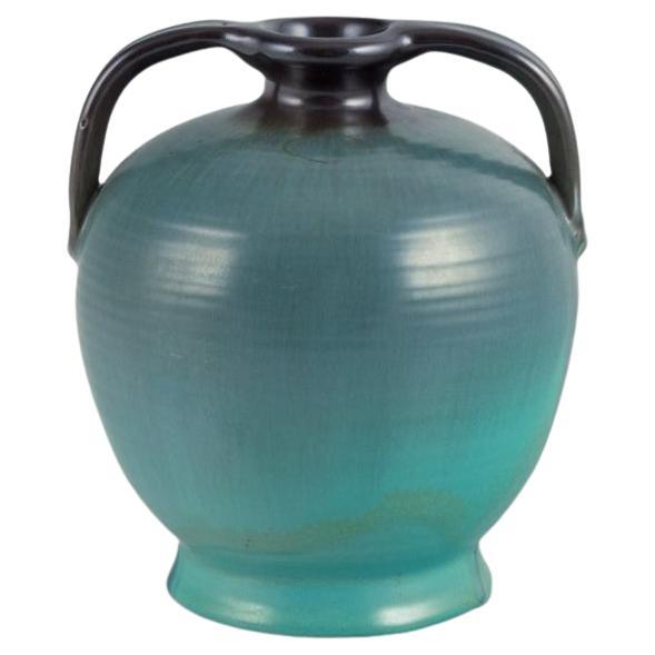 Upsala Ekeby ceramic vase with two handles. Glaze in greenish tones. For Sale