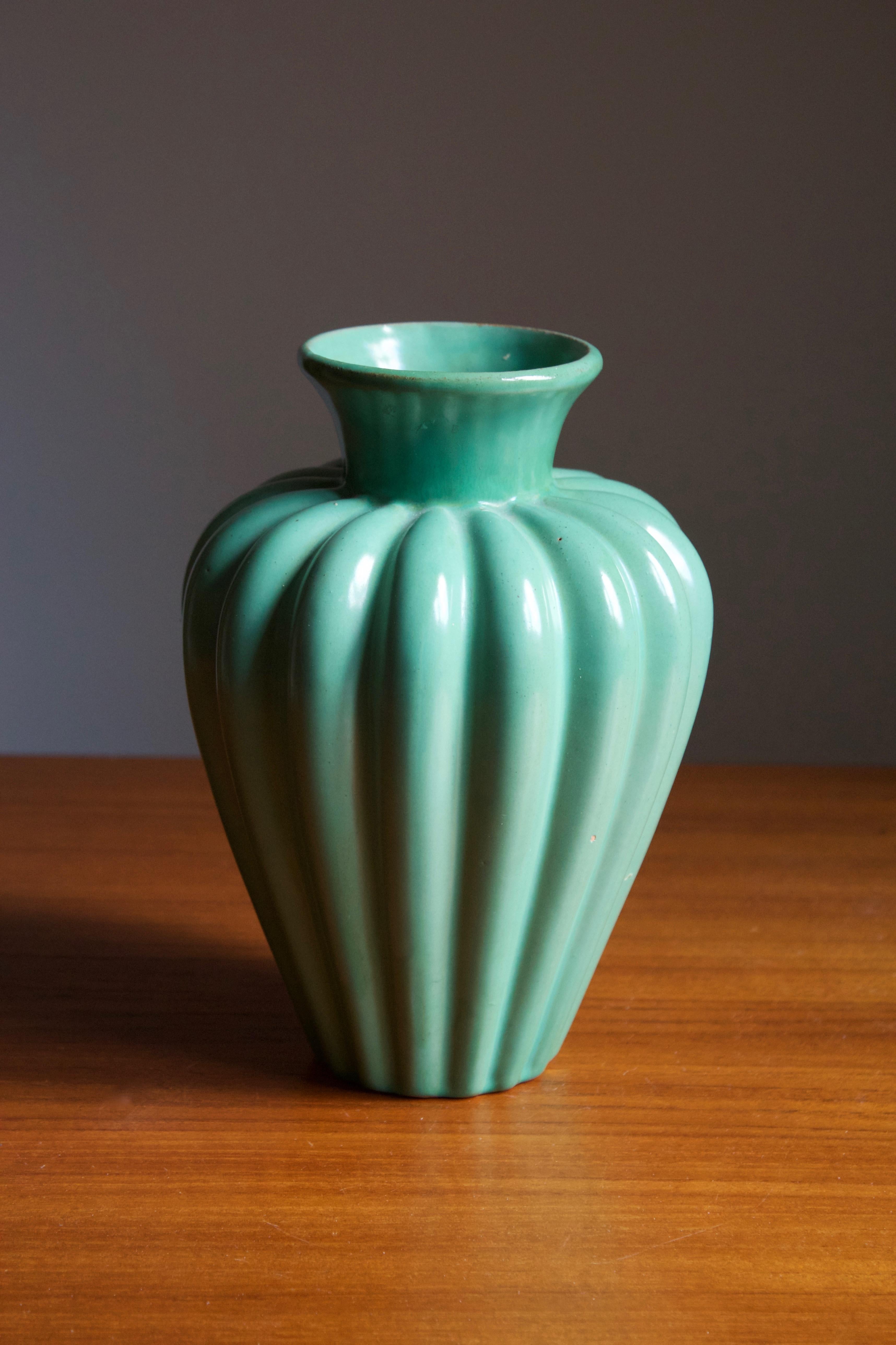 An early modernist vase. Produced by Upsala-Ekeby, Sweden, 1940s. Earthenware. 

Other designers of the period include Ettore Sottsass, Carl Harry Stålhane, Lisa Larsson, Axel Salto, and Arne Bang.