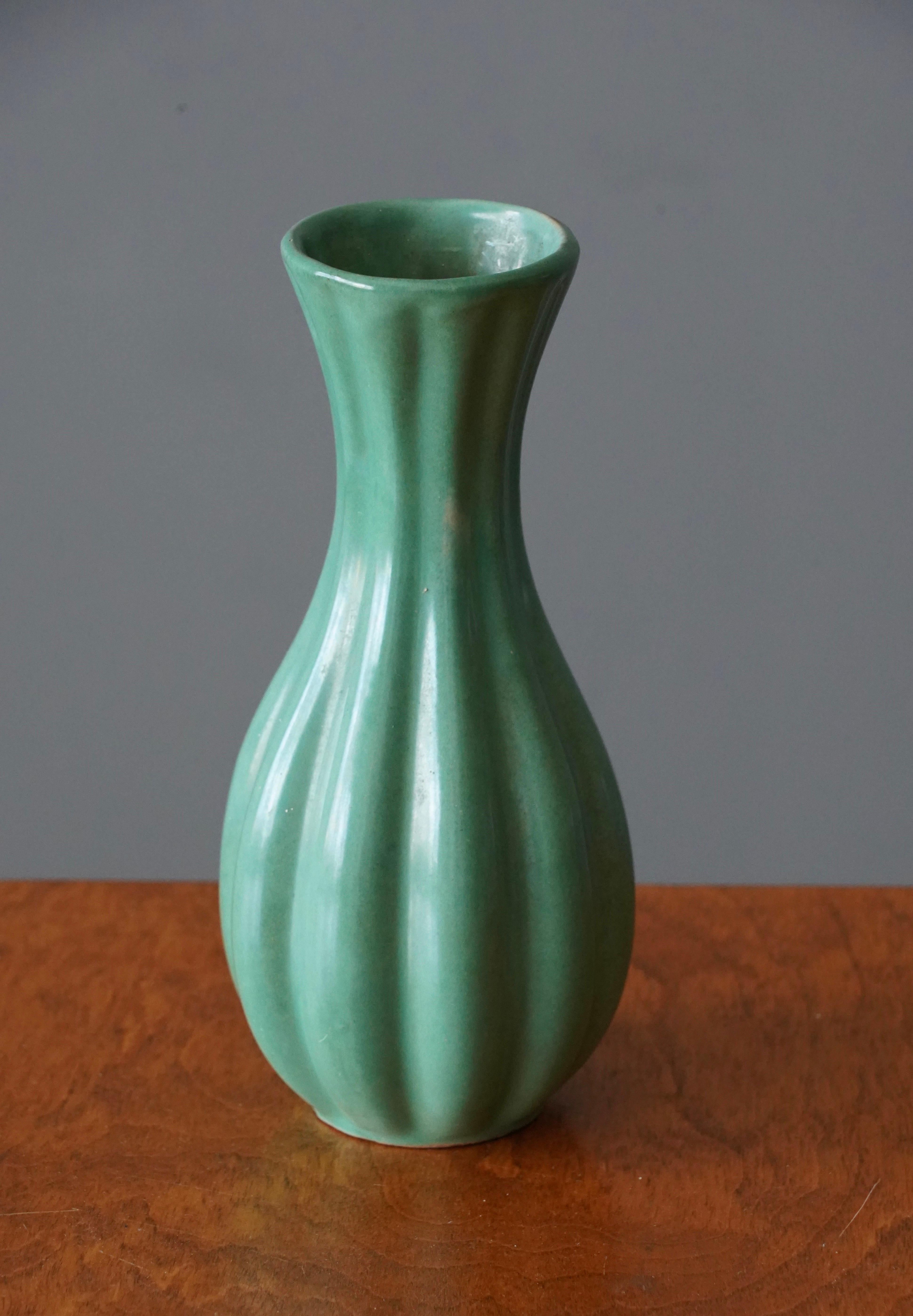 A vase. Produced by Upsala-Ekeby, Sweden, 1940s. Earthenware.

Other designers of the period include Ettore Sottsass, Carl Harry Stålhane, Lisa Larsson, Axel Salto, and Arne Bang.