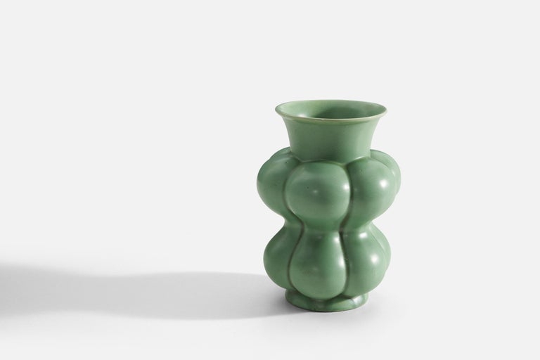 A green-glazed earthenware rare freeform vase produced by Upsala-Ekeby, Sweden, 1940s. 

