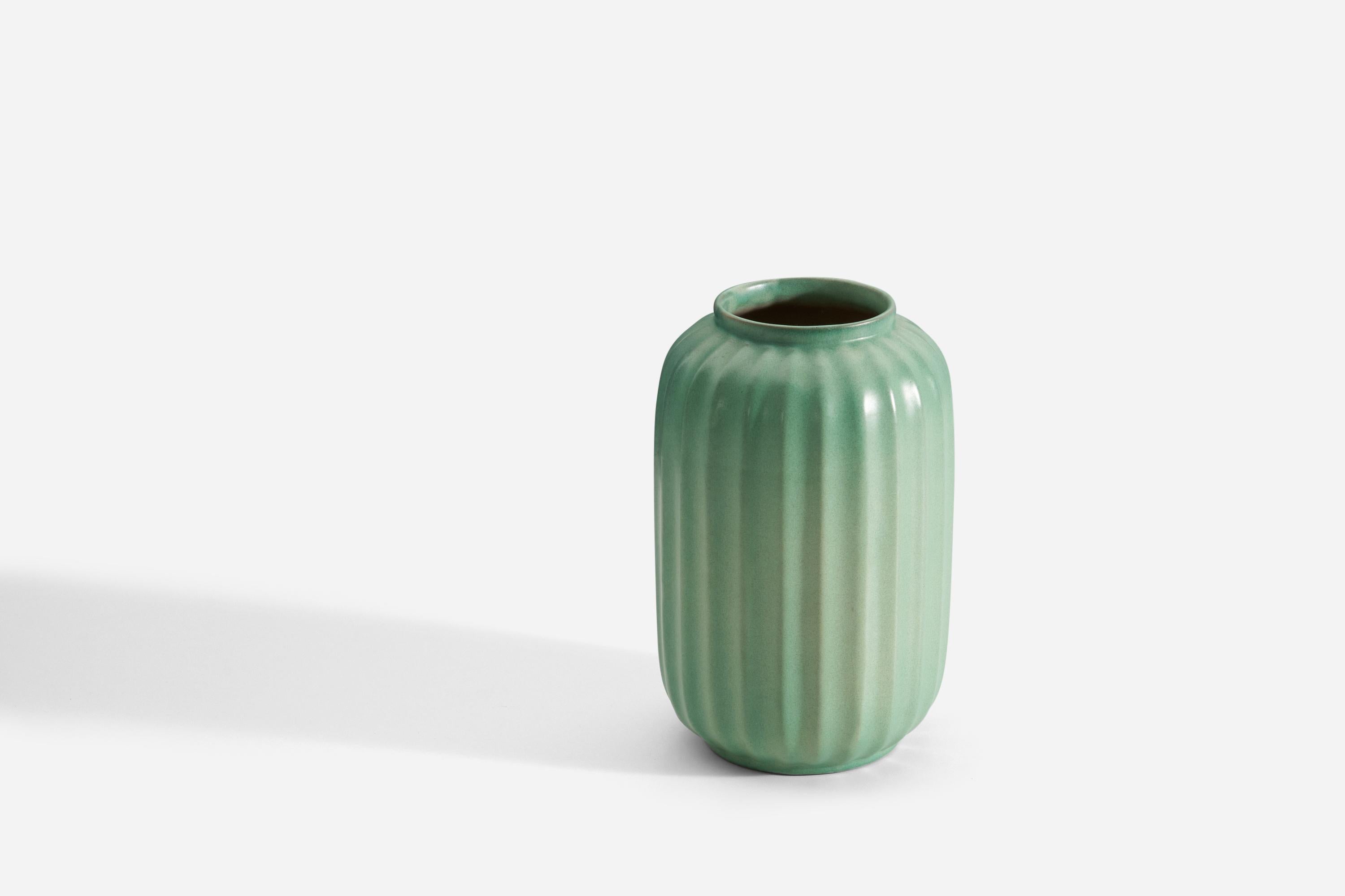 An early modernist vase. Produced by Upsala-Ekeby, Sweden, 1940s. Earthenware. 

Other designers of the period include Ettore Sottsass, Carl Harry Stålhane, Lisa Larsson, Axel Salto, and Arne Bang.
