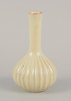 Upsala Ekeby, Sweden. Ceramic vase with a round shape and narrow neck.