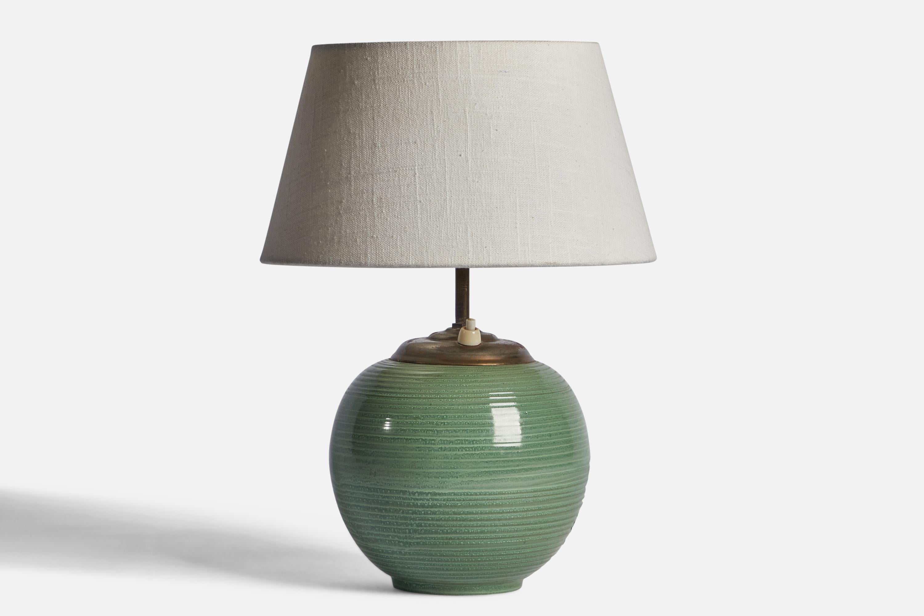 A green-glazed incised earthenware and brass table lamp designed and produced by Upsala Ekeby, Sweden, 1930s.

Dimensions of Lamp (inches): 11” H x 6.25” Diameter
Dimensions of Shade (inches): 7” Top Diameter x 10” Bottom Diameter x