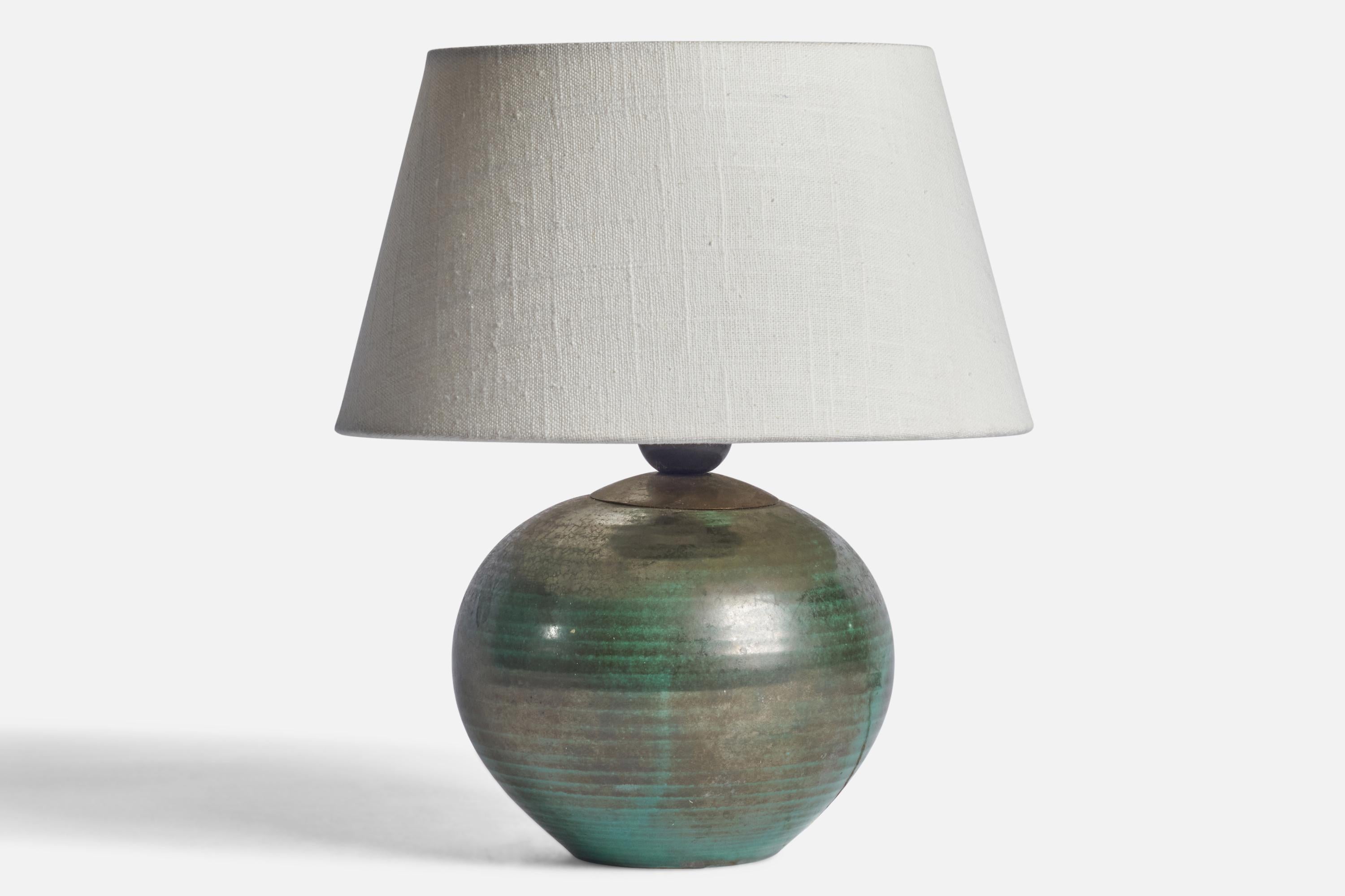 A green-glazed and incised earthenware table lamp designed and produced by Upsala Ekeby, Sweden, 1930s.

Dimensions of Lamp (inches): 8.75” H x 6”Diameter
Dimensions of Shade (inches): 7” Top Diameter x 10” Bottom Diameter x 5.5” H
Dimensions of