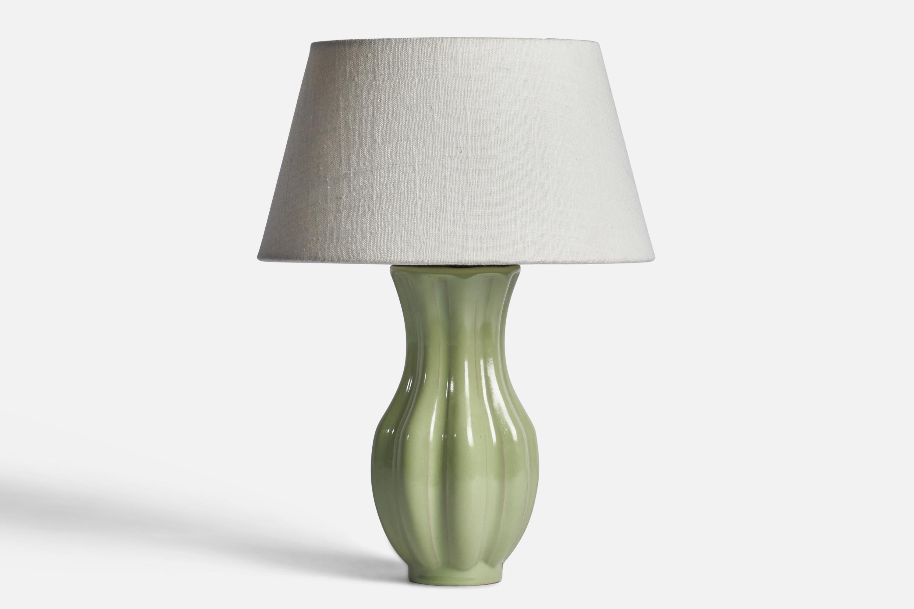 A green-glazed and fluted earthenware table lamp designed and produced by Upsala Ekeby, Sweden, 1930s.

Dimensions of Lamp (inches): 10.25
