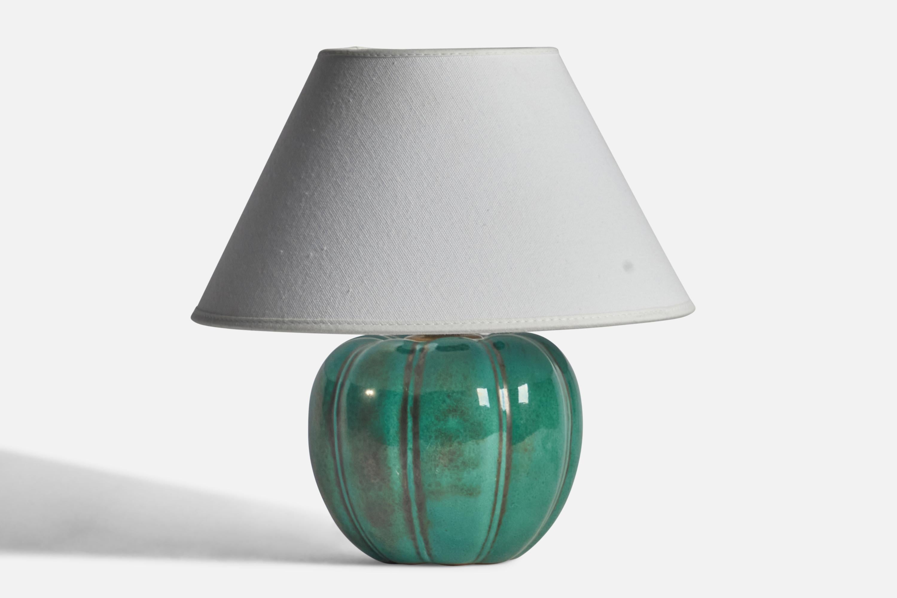 A green-glazed fluted stoneware table lamp designed and produced by Upsala Ekeby, Sweden, 1930s.

“EKEBY 321” stamp on bottom
Dimensions of Lamp (inches): 7.25” H x 5.5” Diameter
Dimensions of Shade (inches): 4.25” Top Diameter x 9.75” Bottom