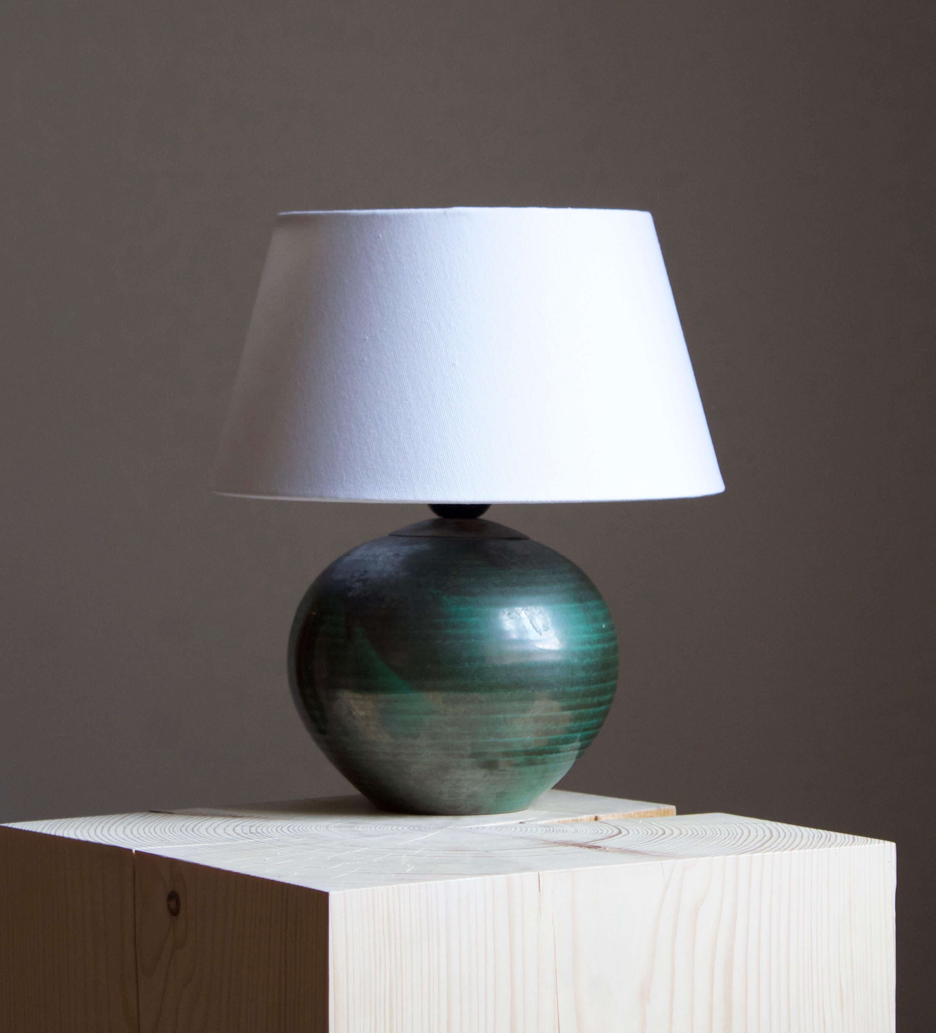 An early modernist table lamp. by Upsala-Ekeby, Sweden, 1930s. Stamped. 

Stated dimensions exclude lampshade. Height includes the socket. Sold without lampshade.

Other designers of the period include Ettore Sottsass, Carl Harry Stålhane, Lisa