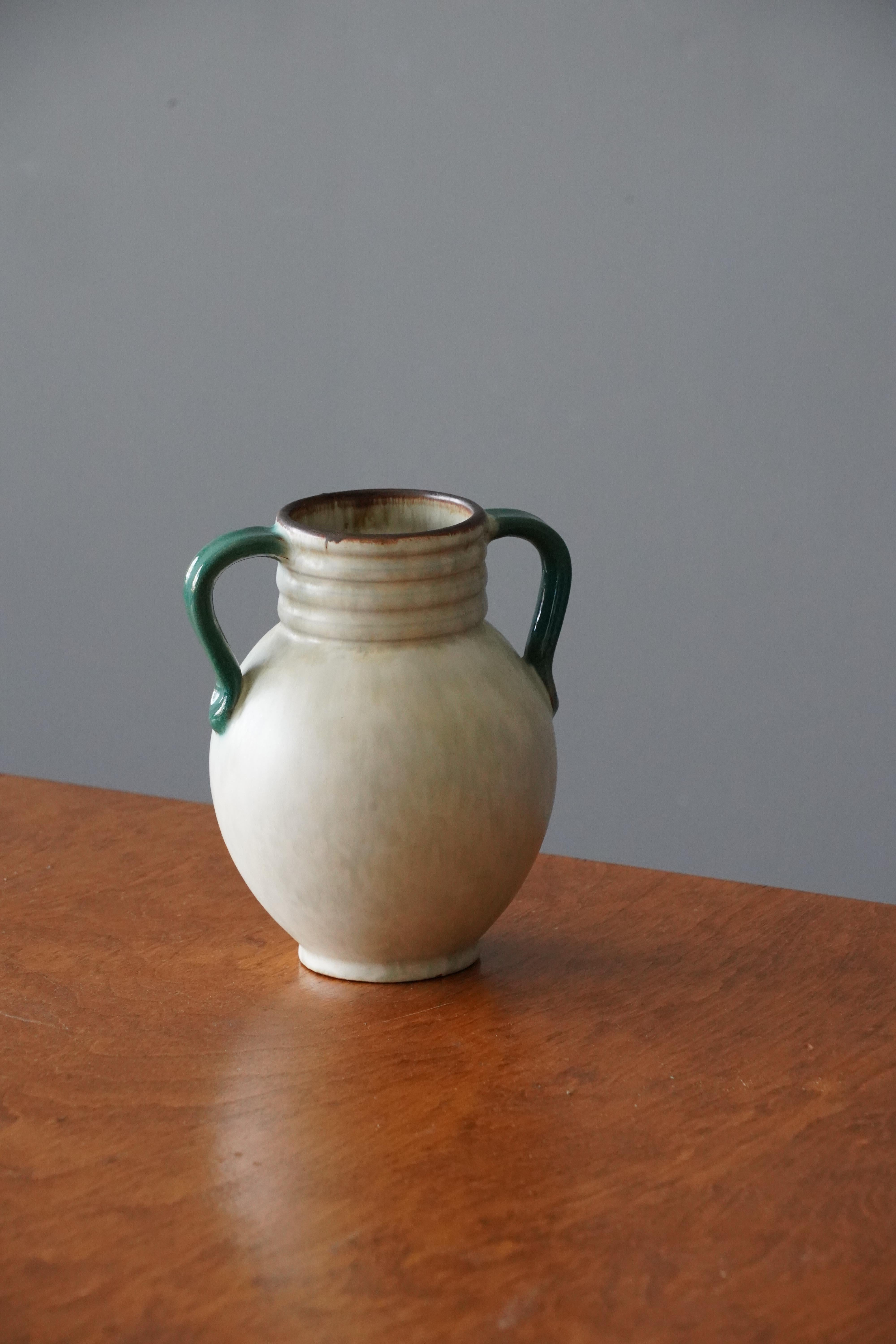 A vase. Produced by Upsala-Ekeby, Sweden, 1940s. Earthenware.

Other designers of the period include Ettore Sottsass, Carl Harry Stålhane, Lisa Larsson, Axel Salto, and Arne Bang.