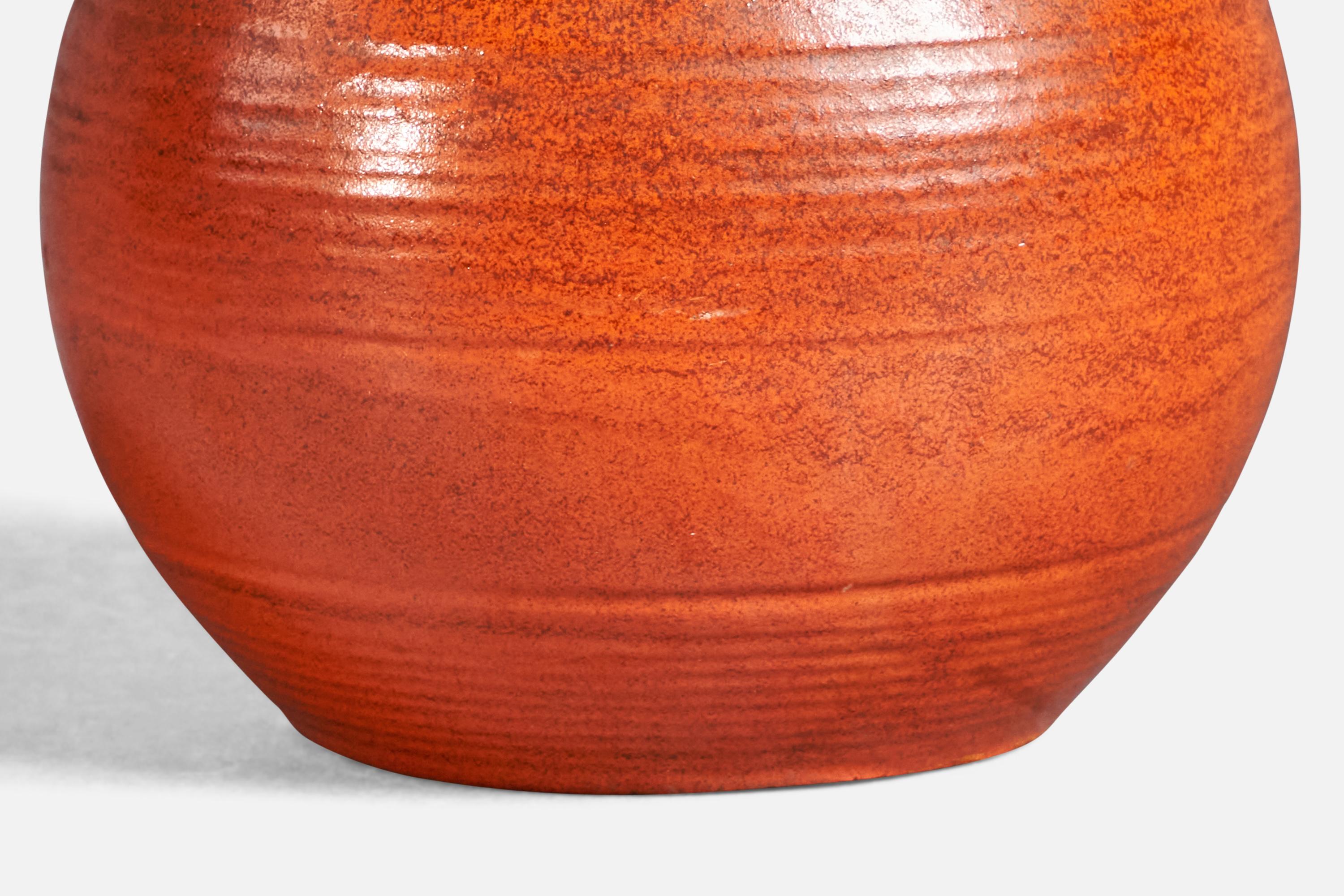 A black and orange-glazed and incised earthenware vase, designed and produced by Upsala Ekeby, Sweden, c. 1930s.