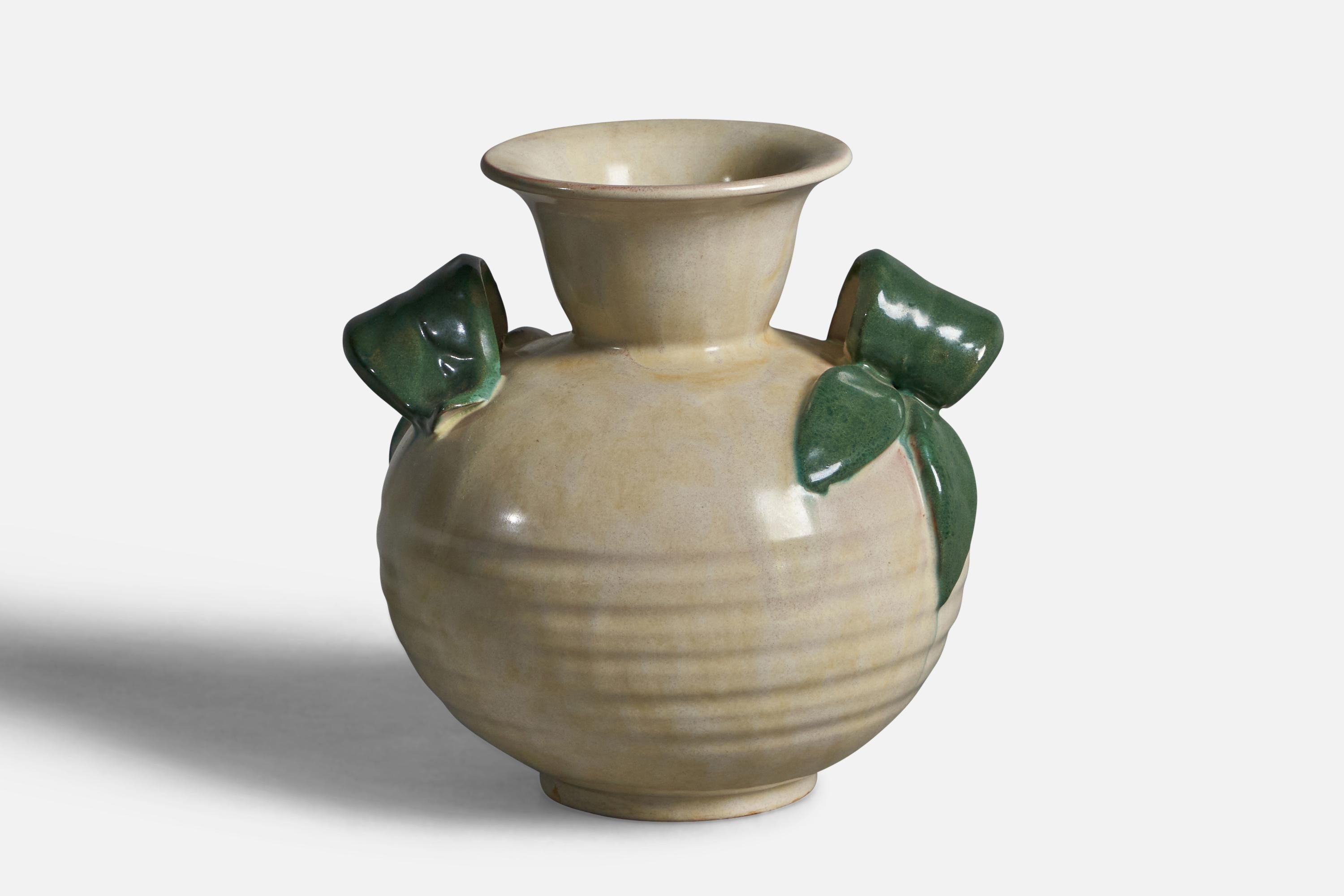 An incised green and off-white-glazed earthenware vase designed and produced by Upsala Ekeby, Sweden, 1930s.