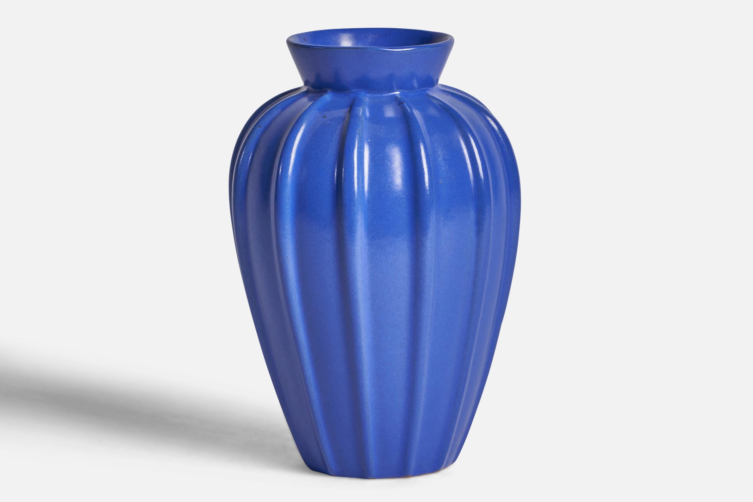 A blue-glazed fluted earthenware vase designed and produced by Upsala Ekeby, Sweden, 1930s.