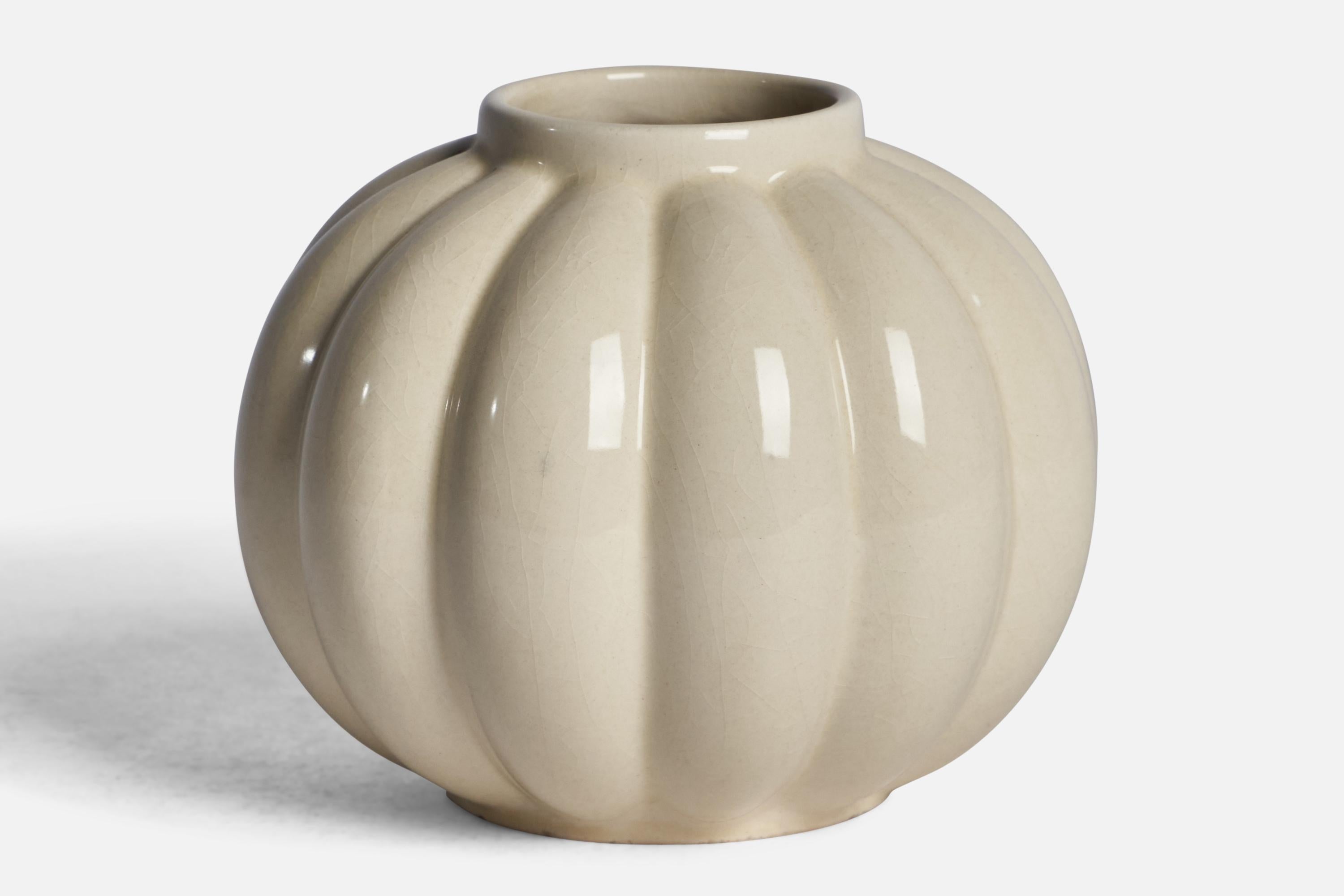 An off-white-glazed earthenware vase designed and produced by Upsala Ekeby, Sweden, 1930s.