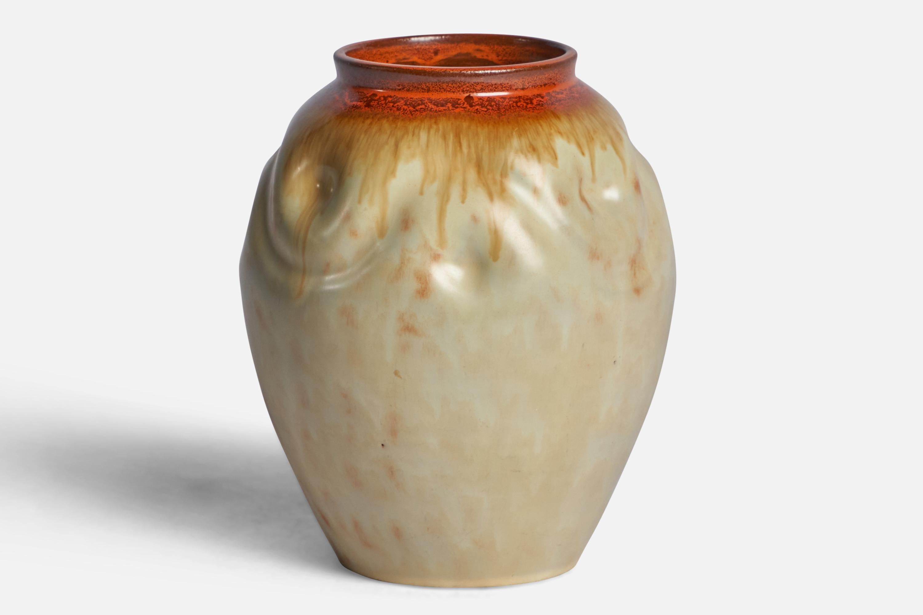 A beige and orange-glazed incised earthenware vase designed and produced by Upsala Ekeby, Sweden, 1930s.