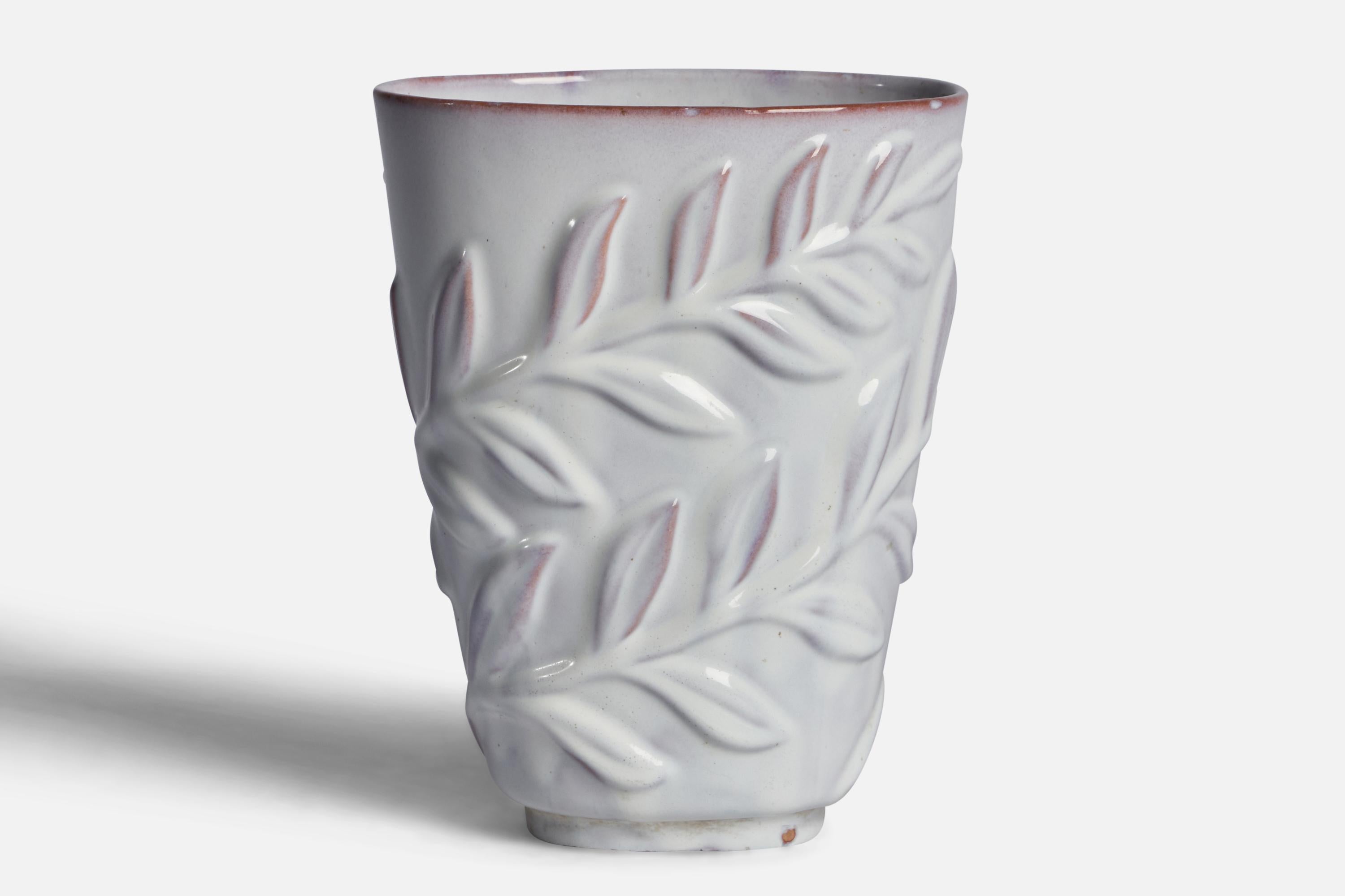 A white-glazed incised earthenware vase designed and produced by Upsala Ekeby, Sweden, 1930s.