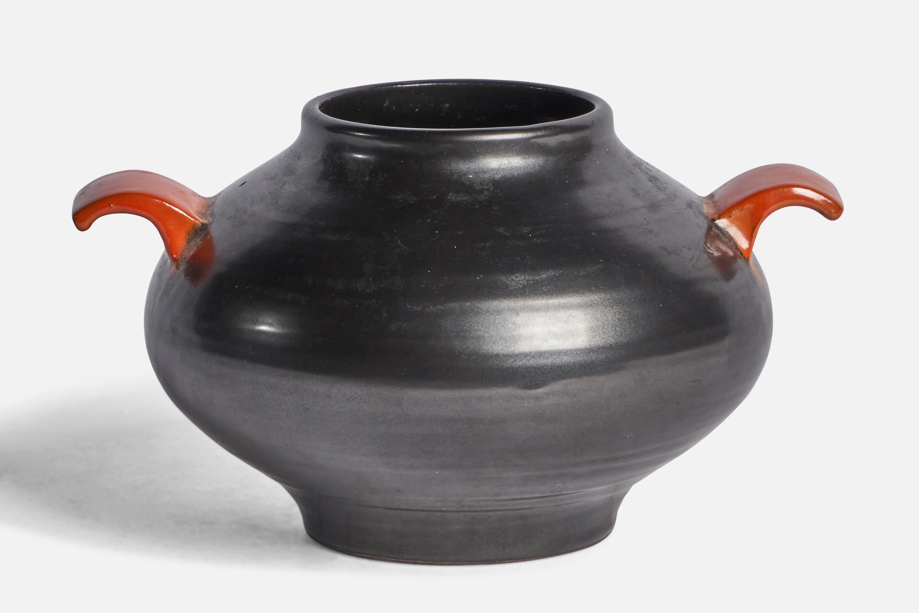 A black and orange-glazed earthenware vase designed and produced by Upsala Ekeby, Sweden, 1930s.