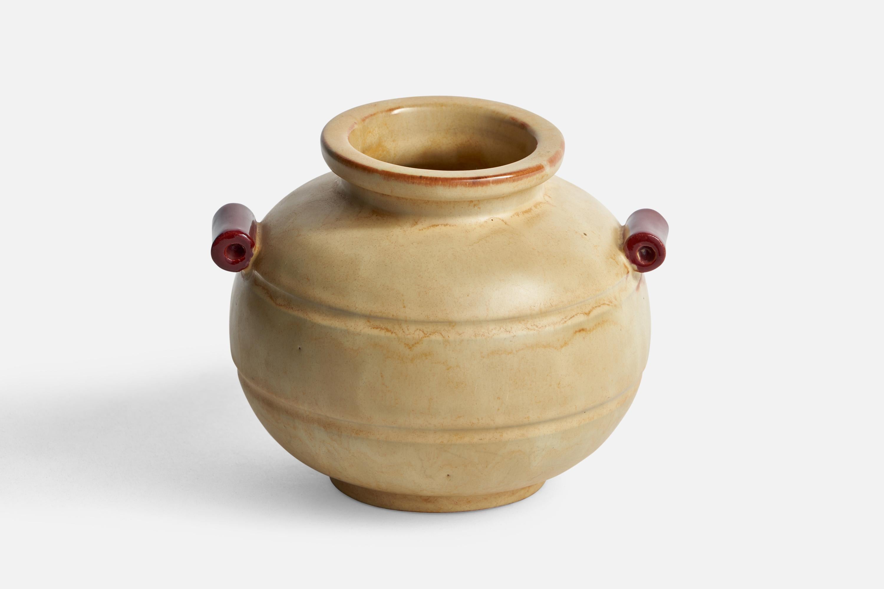 A beige and red-glazed earthenware vase designed and produced by Upsala Ekeby, Sweden, 1930s.