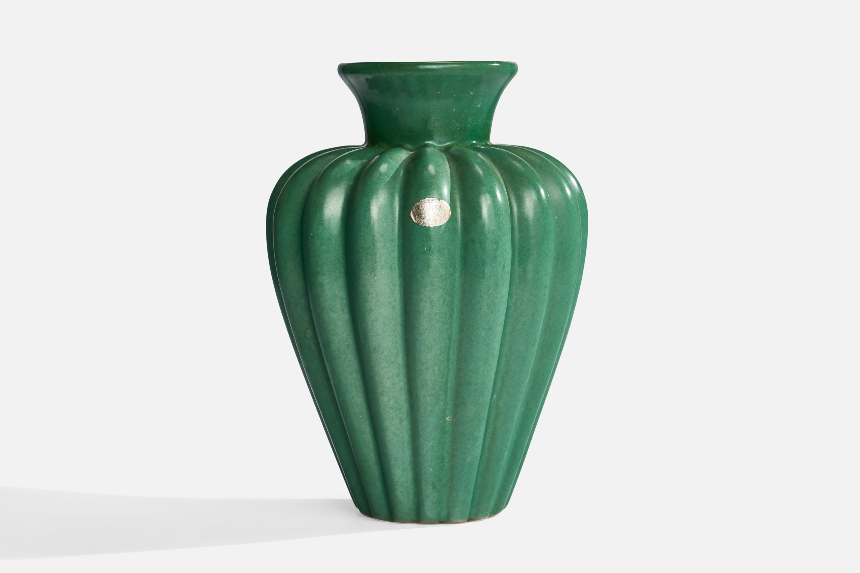 A green-glazed fluted earthenware vase, designed and produced by Upsala Ekeby, Sweden, 1930s.