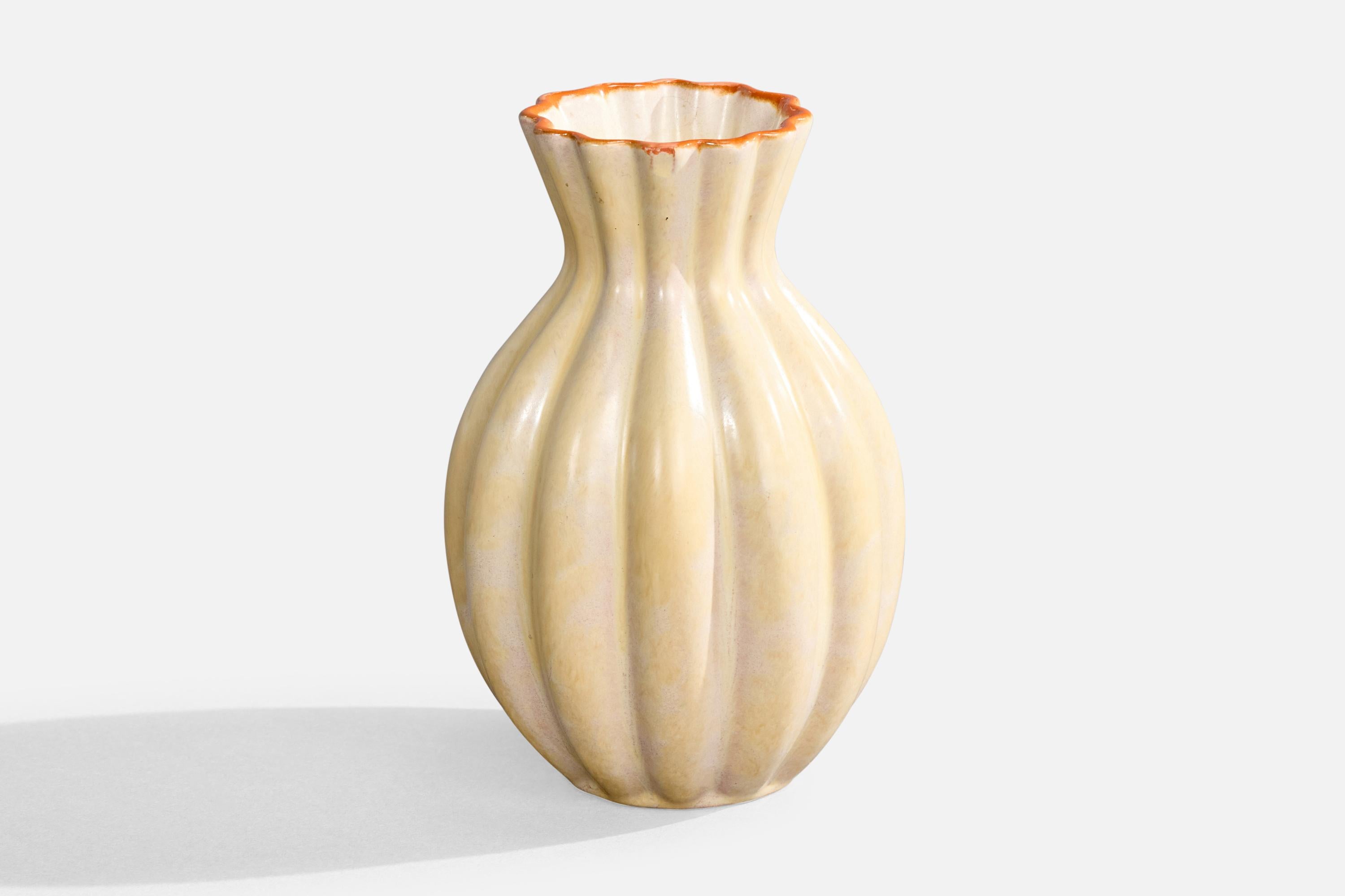 An beige and orange-glazed earthenware vase produced by Upsala Ekeby, Sweden, c. 1930s.

Overall Dimensions (inches): 6.5
