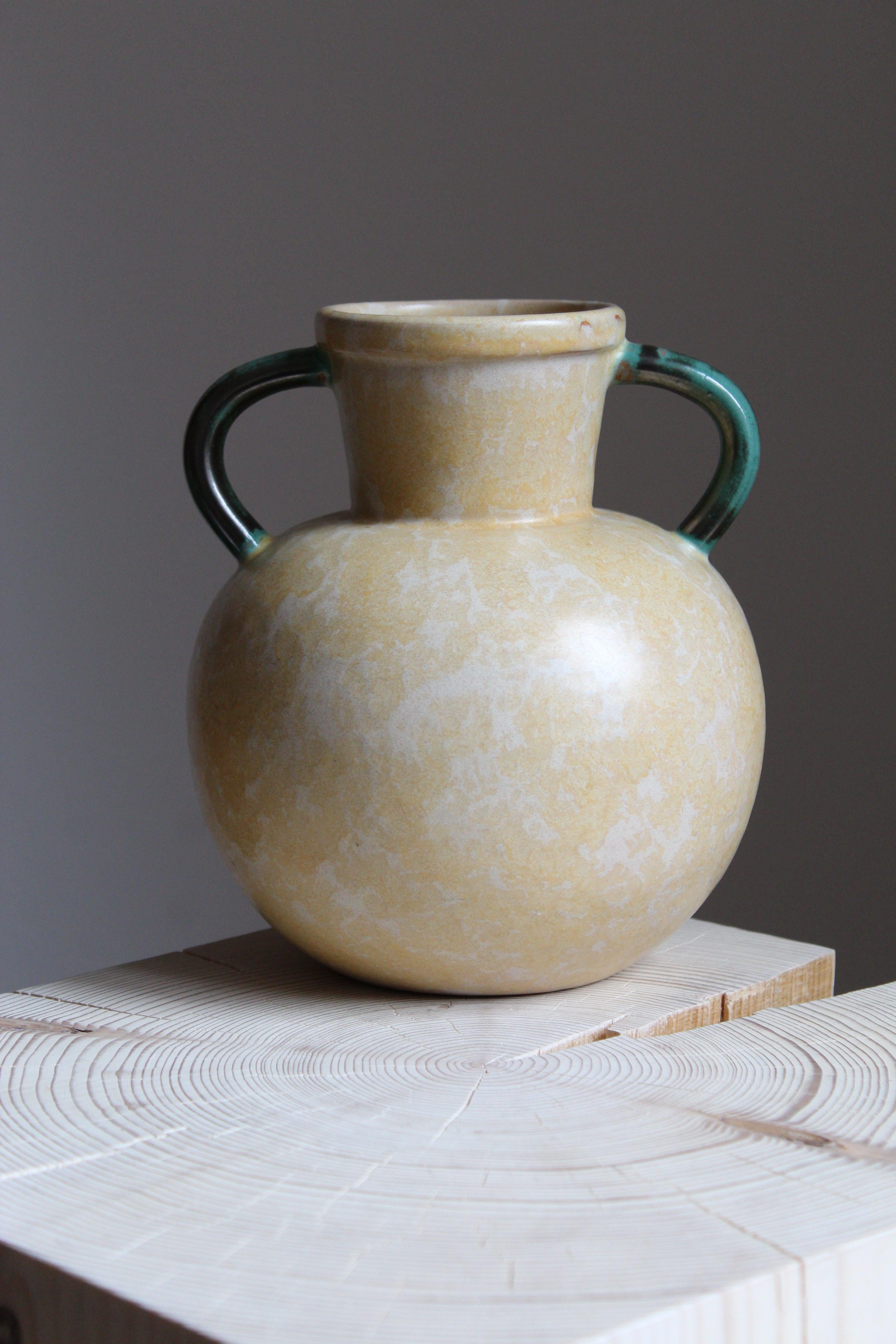 An early modernist vase. Produced by Upsala-Ekeby, Sweden, 1940s. Stoneware or earthenware. 

Other designers of the period include Ettore Sottsass, Carl Harry Stålhane, Lisa Larsson, Axel Salto, and Arne Bang.