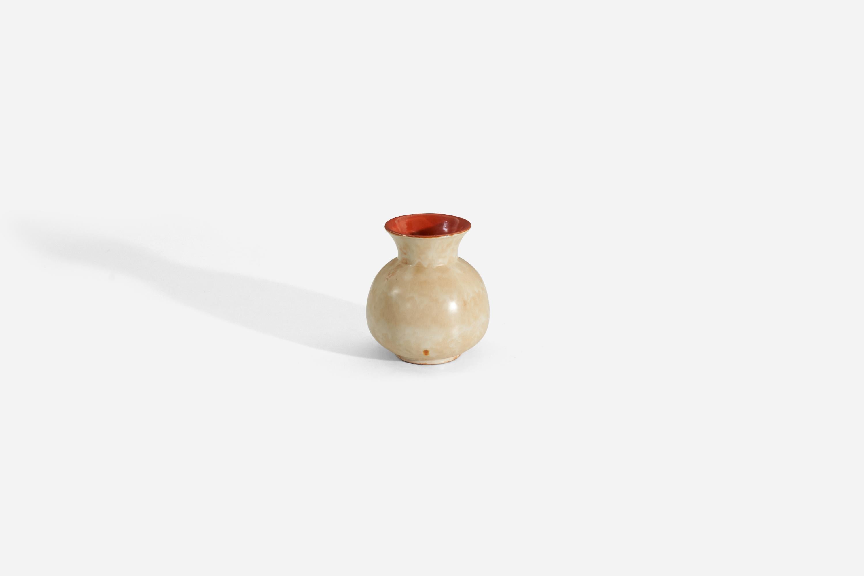 A beige and orange-glazed earthenware vase produced by Upsala-Ekeby, Sweden, 1940s.

