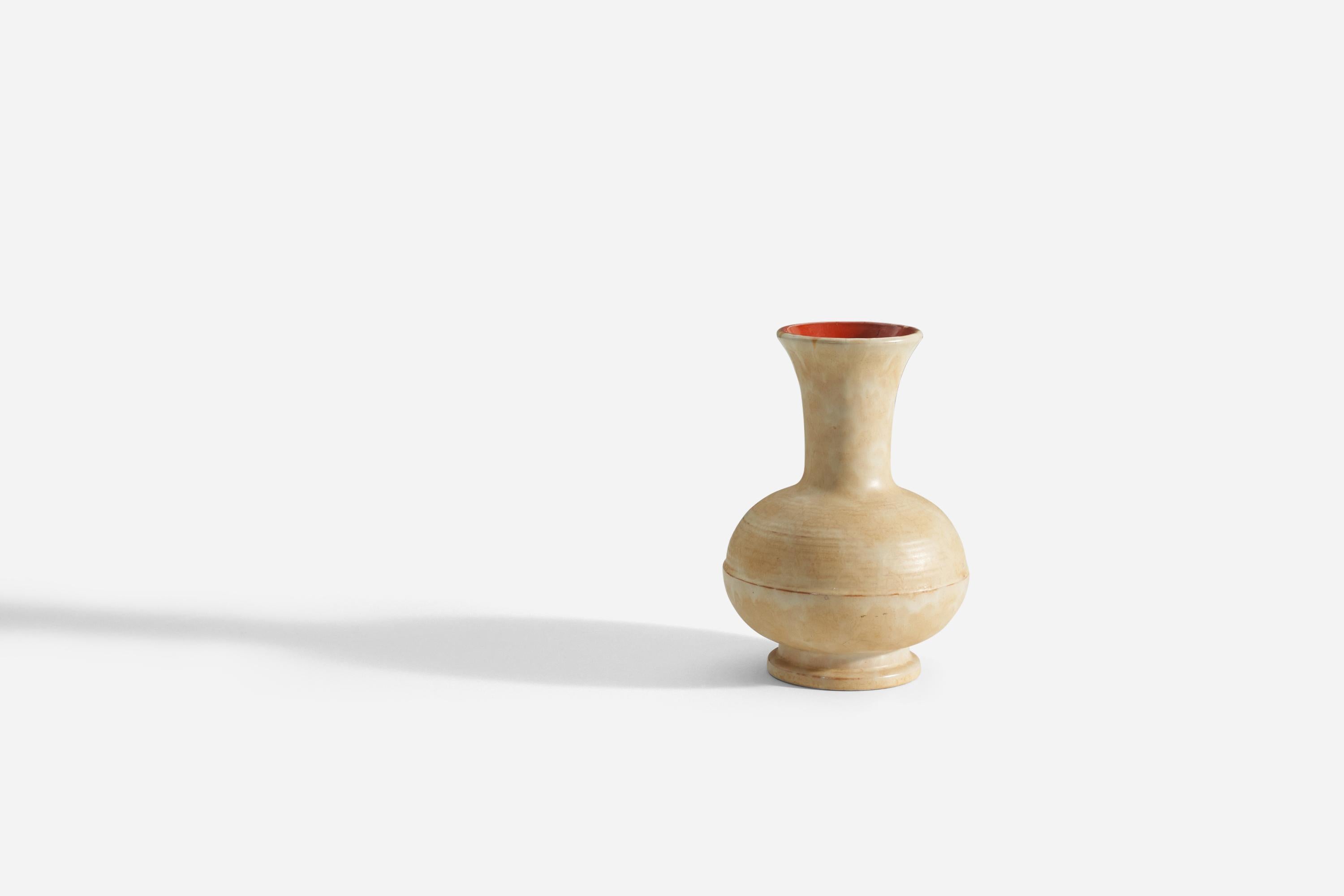 A yellow / cream earthenware vase produced by Upsala-Ekeby, Sweden, 1940s.

Other designers of the period include Ettore Sottsass, Carl Harry Stålhane, Lisa Larsson, Axel Salto, and Arne Bang.