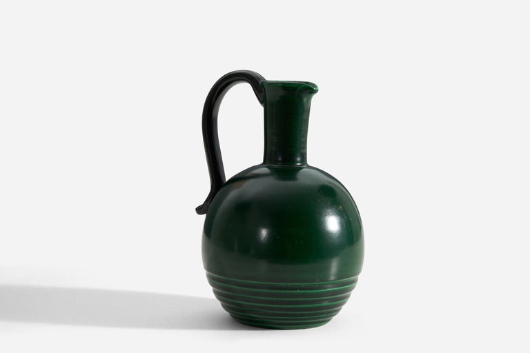 A green-glazed earthenware vase Produced by Upsala-Ekeby, Sweden, 1940s. 

