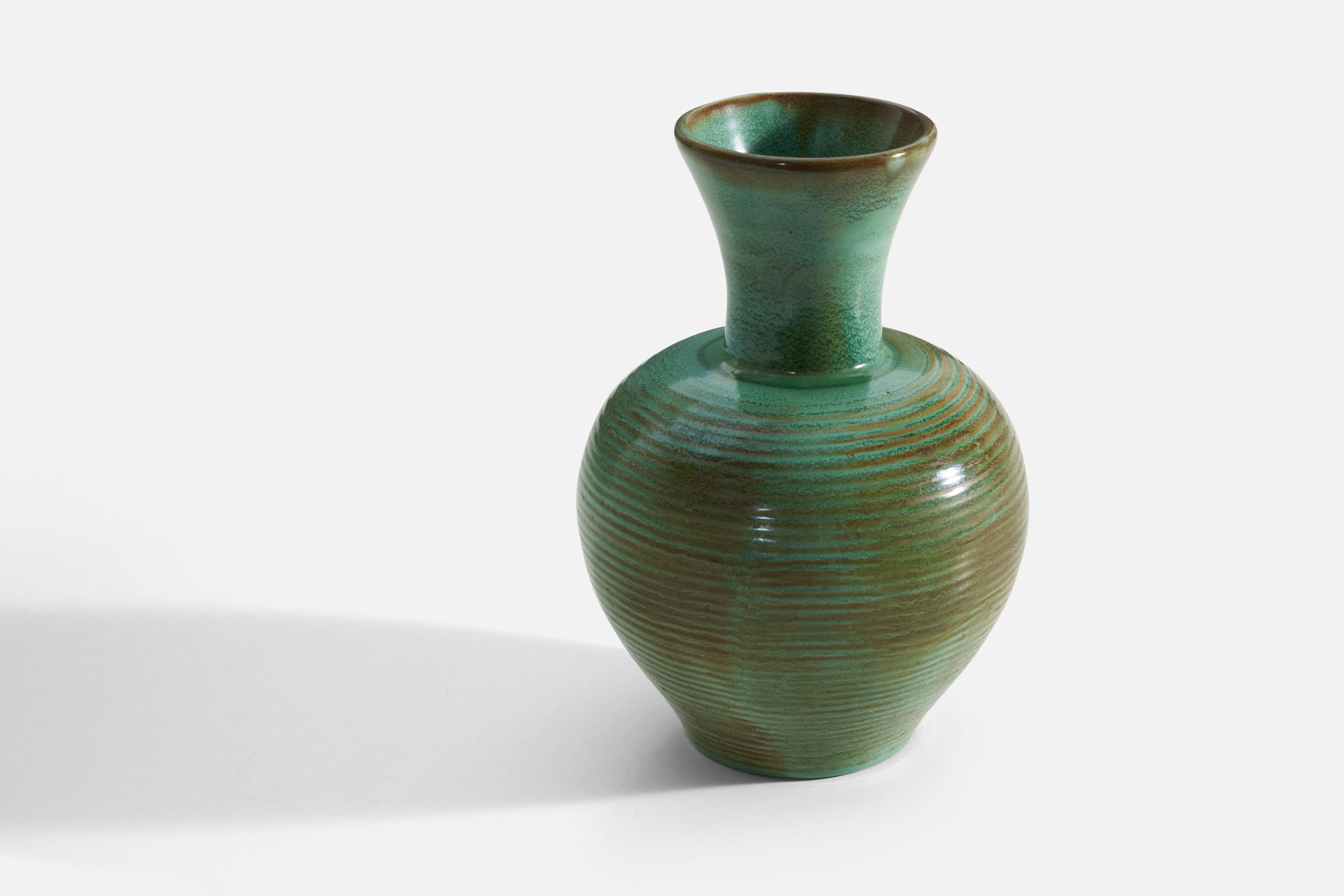 A green earthenware vase produced by Upsala-Ekeby, Sweden, 1940s. 

