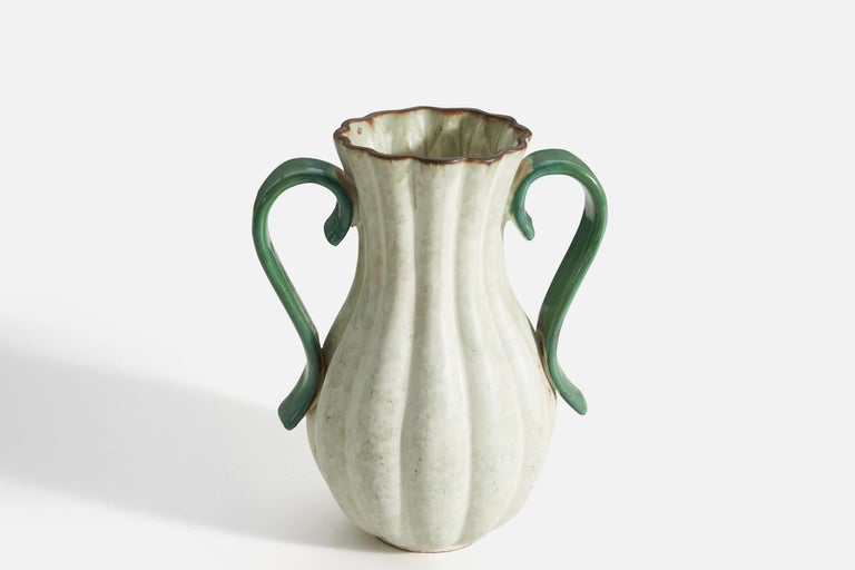 A white-glazed, earthenware vase with green handles produced by Upsala-Ekeby, Sweden, 1930s-1940s.
 