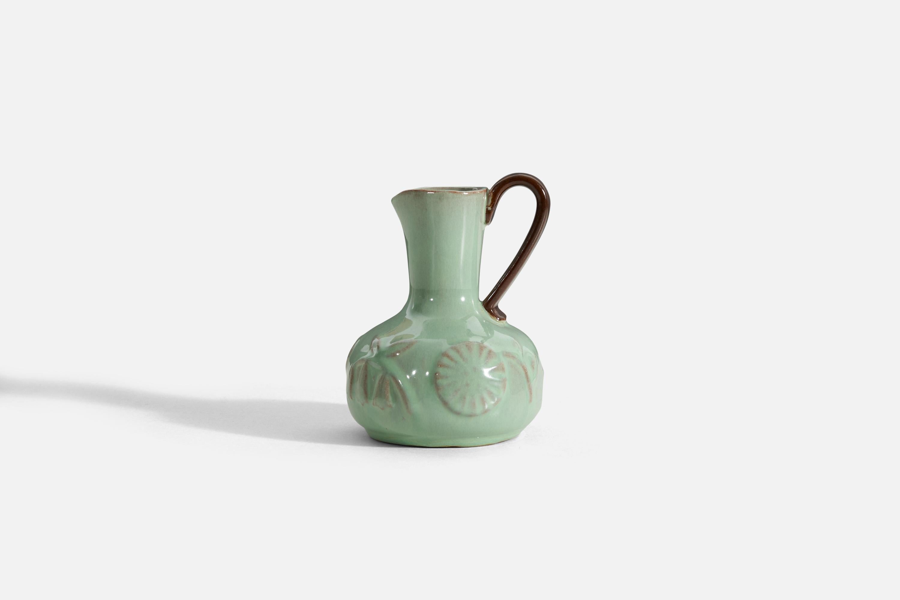 A green-glazed earthenware vase / pitcher with a brown handle produced by Upsala-Ekeby, Sweden, 1940s. 

 