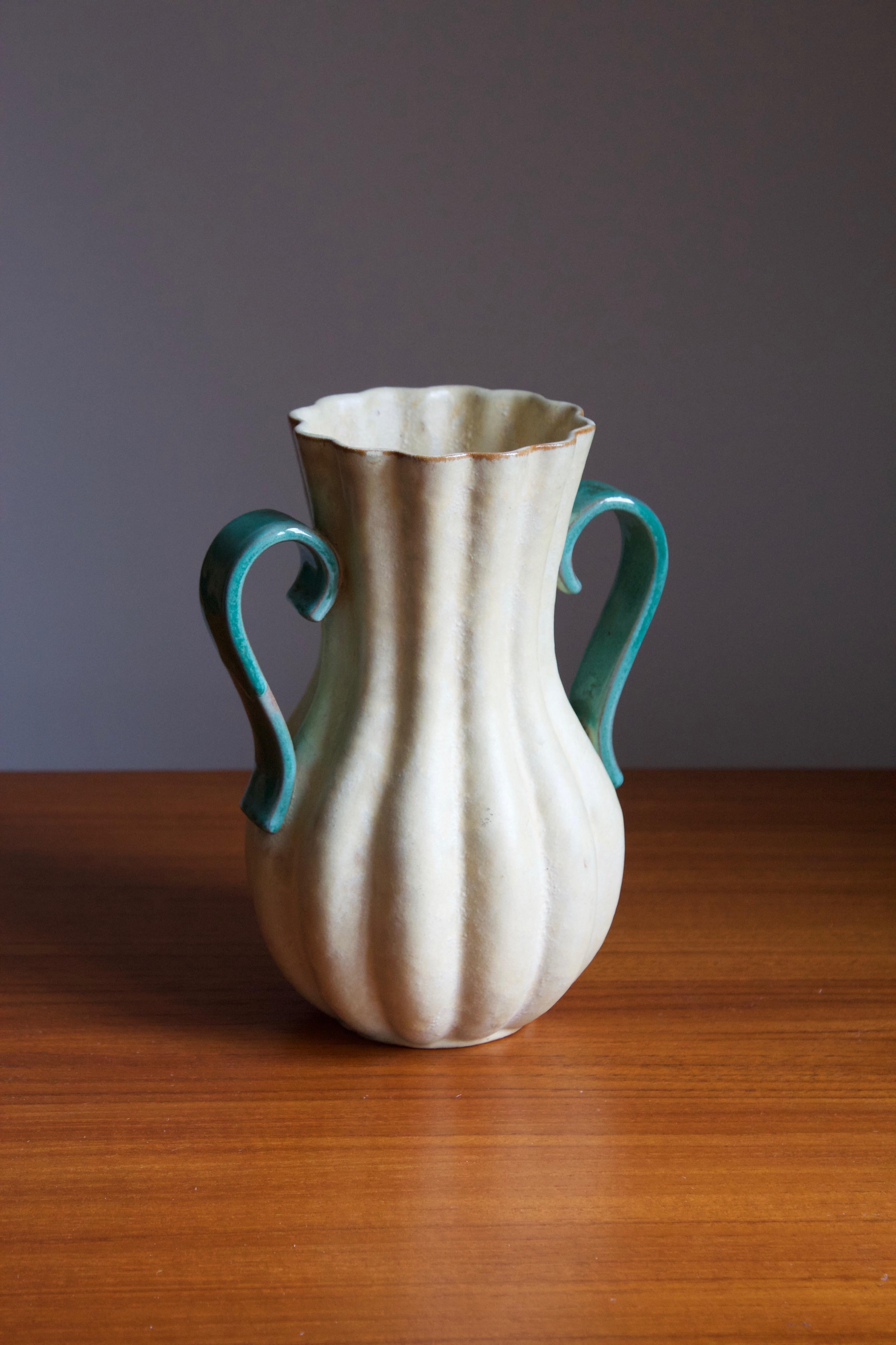 An early modernist vase. Produced by Upsala-Ekeby, Sweden, 1940s. Stoneware or earthenware. 

Other designers of the period include Ettore Sottsass, Carl Harry Stålhane, Lisa Larsson, Axel Salto, and Arne Bang.