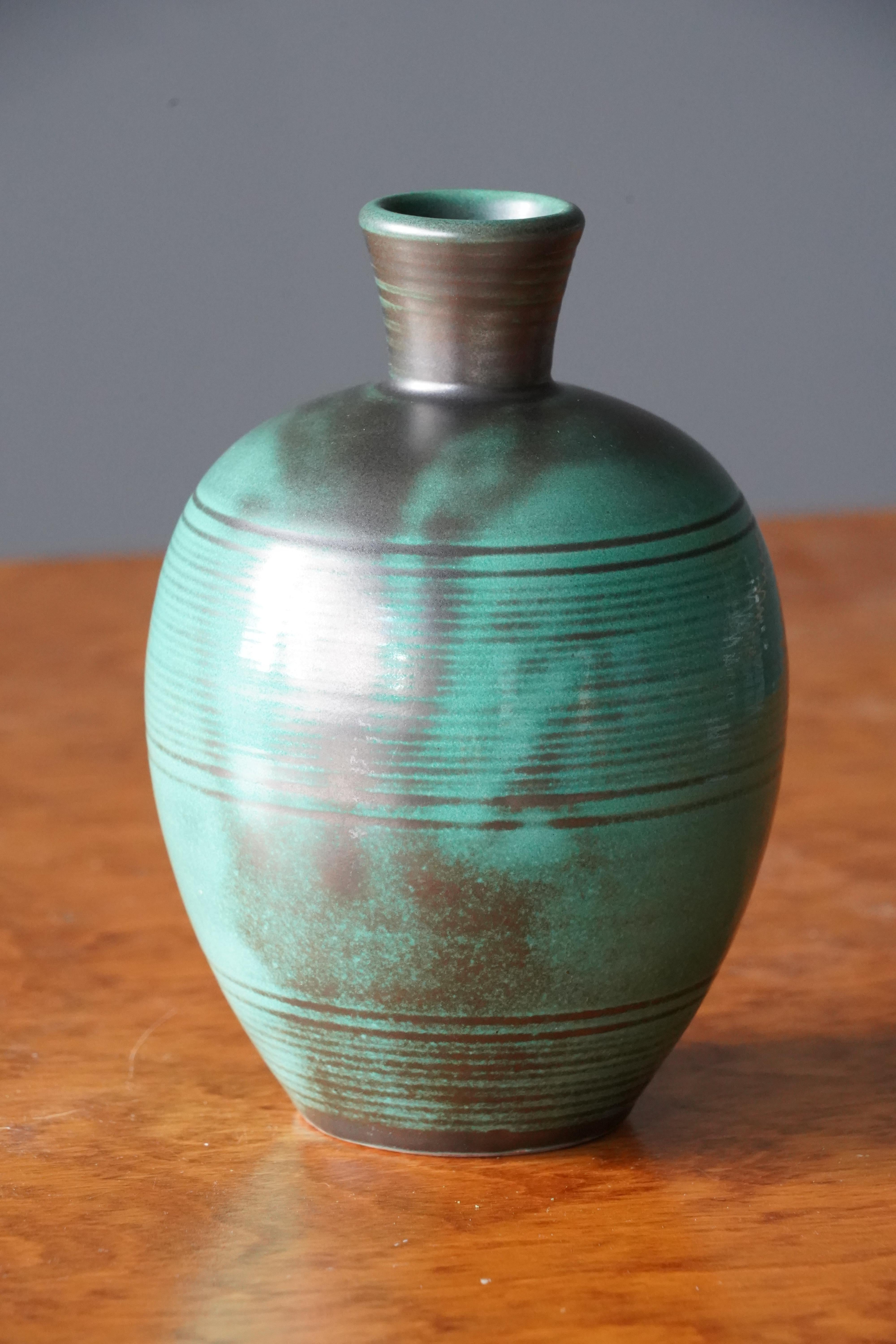 A vase. Produced by Upsala-Ekeby, Sweden, 1940s. Earthenware..

Other designers of the period include Ettore Sottsass, Carl Harry Stålhane, Lisa Larsson, Axel Salto, and Arne Bang.