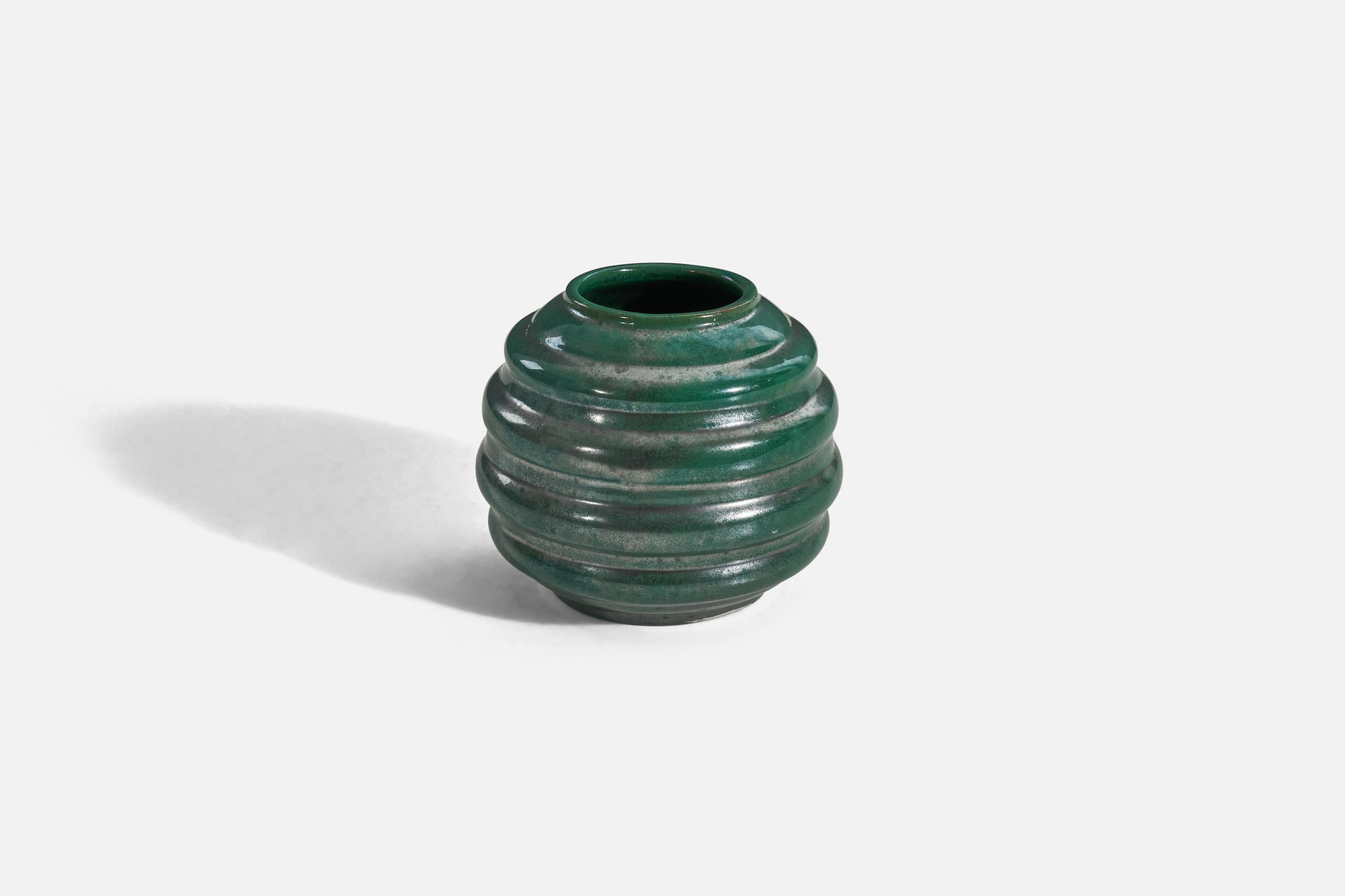A green, glazed earthenware vase designed and produced by Upsala-Ekeby, Sweden, 1940s. 

