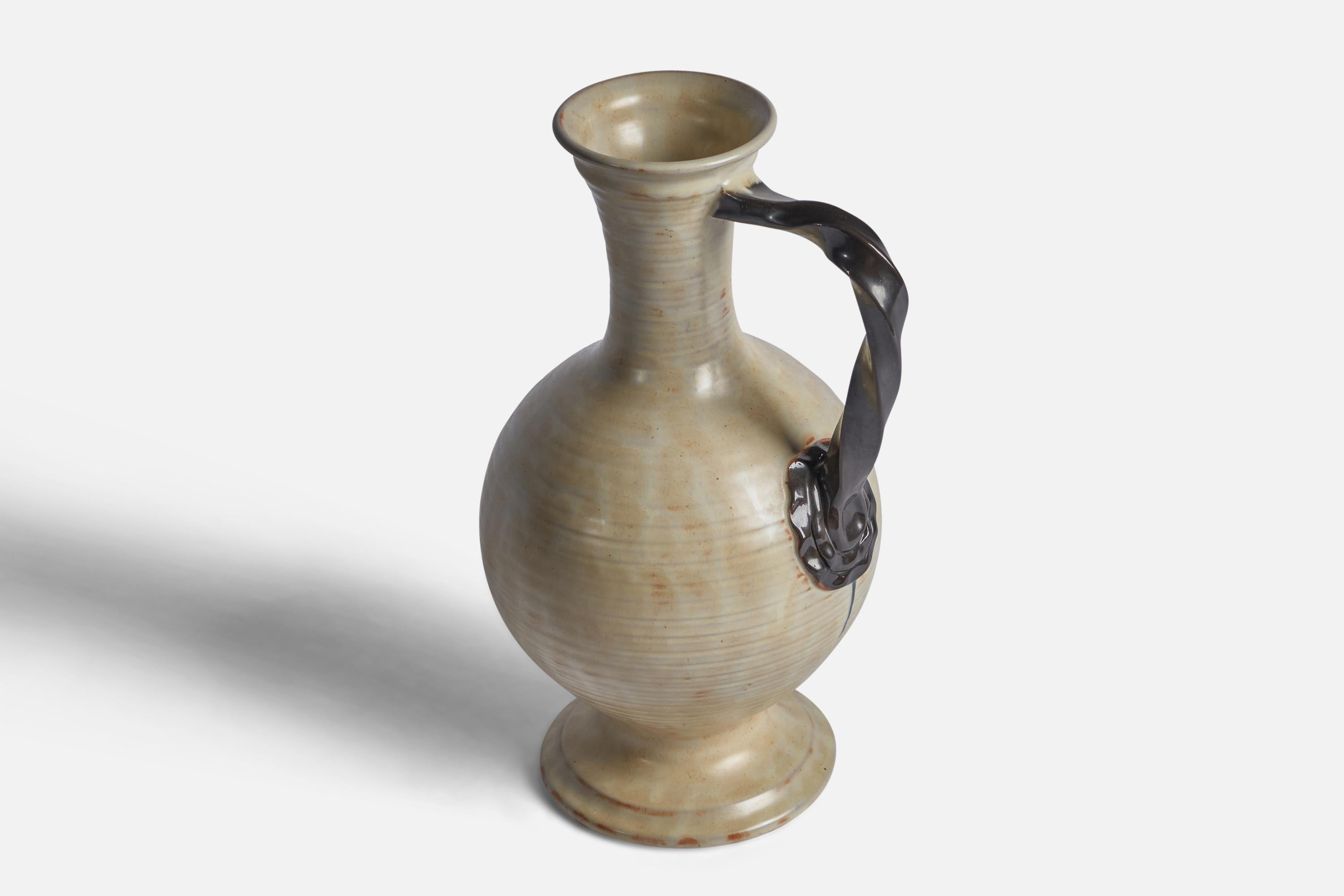 An early modernist vase or pitcher. Produced by Upsala-Ekeby, Sweden, 1940s.


Other designers of the period include Ettore Sottsass, Carl Harry Stålhane, Lisa Larsson, Axel Salto, and Arne Bang.