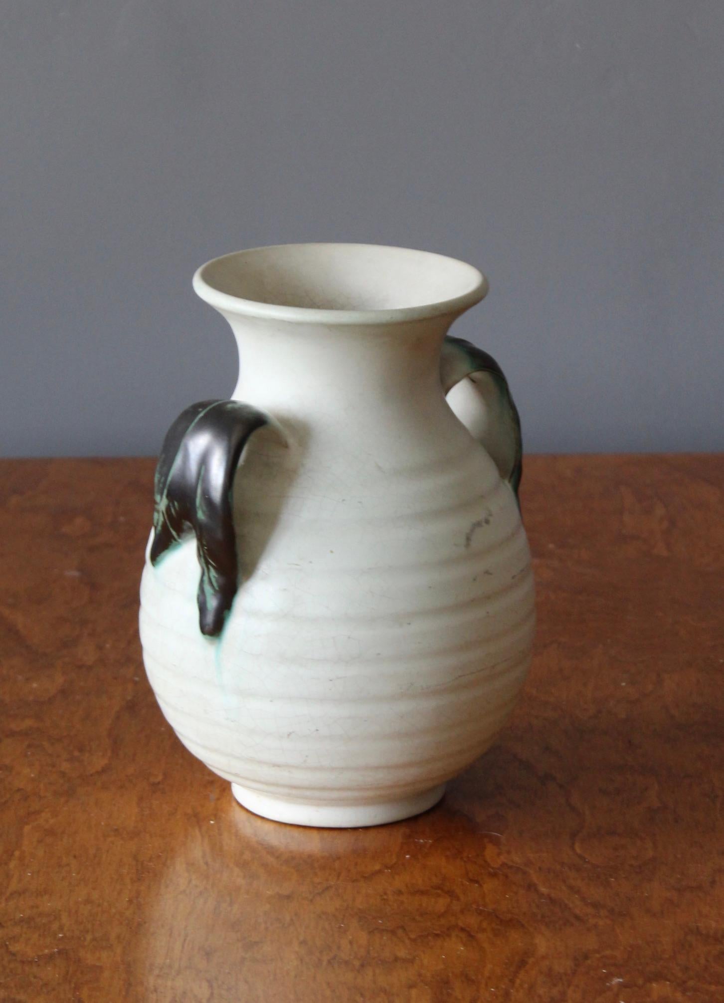 An early modernist vase. Produced by Upsala-Ekeby, Sweden, 1940s. Earthenware. Labeled.

Other designers of the period include Ettore Sottsass, Carl Harry Stålhane, Lisa Larsson, Axel Salto, and Arne Bang.