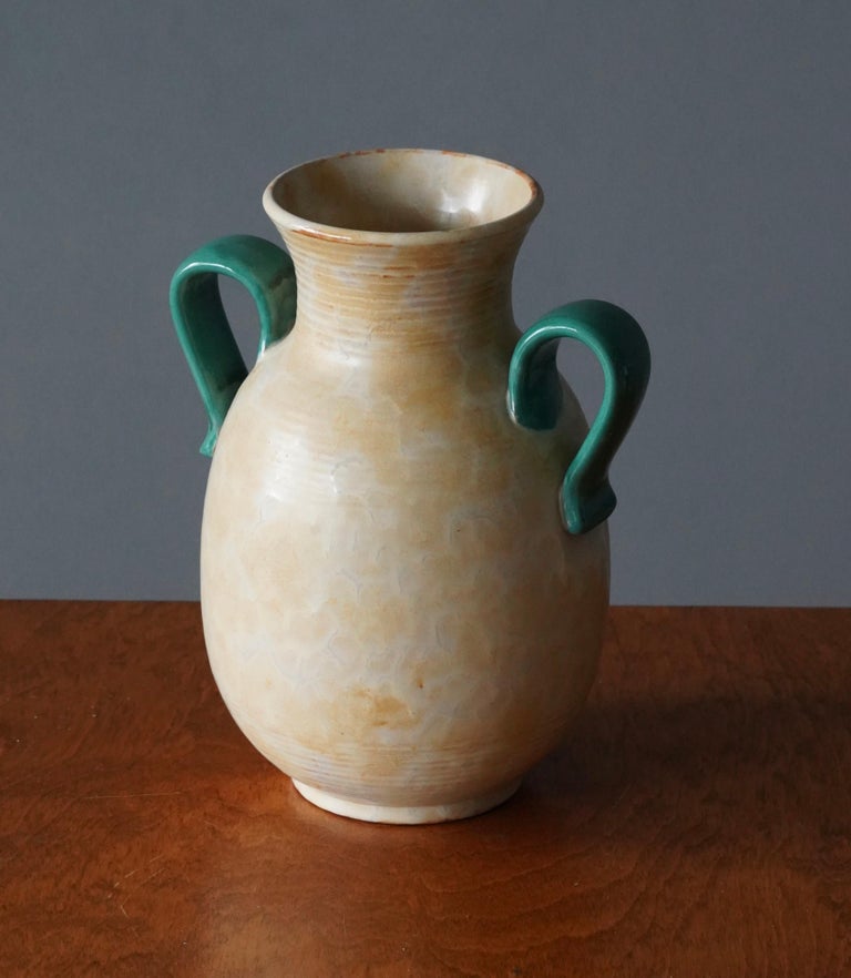 A vase. Produced by Upsala-Ekeby, Sweden, 1940s. Earthenware.

Other designers of the period include Ettore Sottsass, Carl Harry Stålhane, Lisa Larsson, Axel Salto, and Arne Bang.