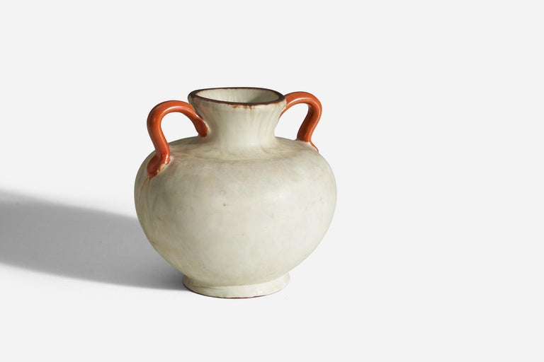 A vase in orange and white-glazed earthenware, designed and produced by Upsala Ekeby, Sweden, 1930s-1940s.
 