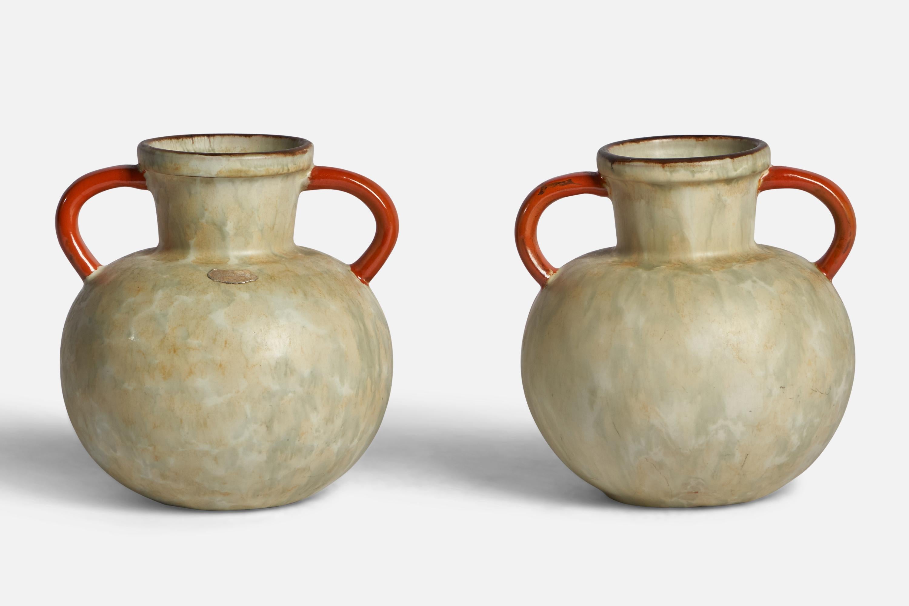 A pair of beige and orange-glazed earthenware vases designed and produced by Upsala Ekeby, Sweden, 1930s.

“EKEBY 97” stamp on bottom