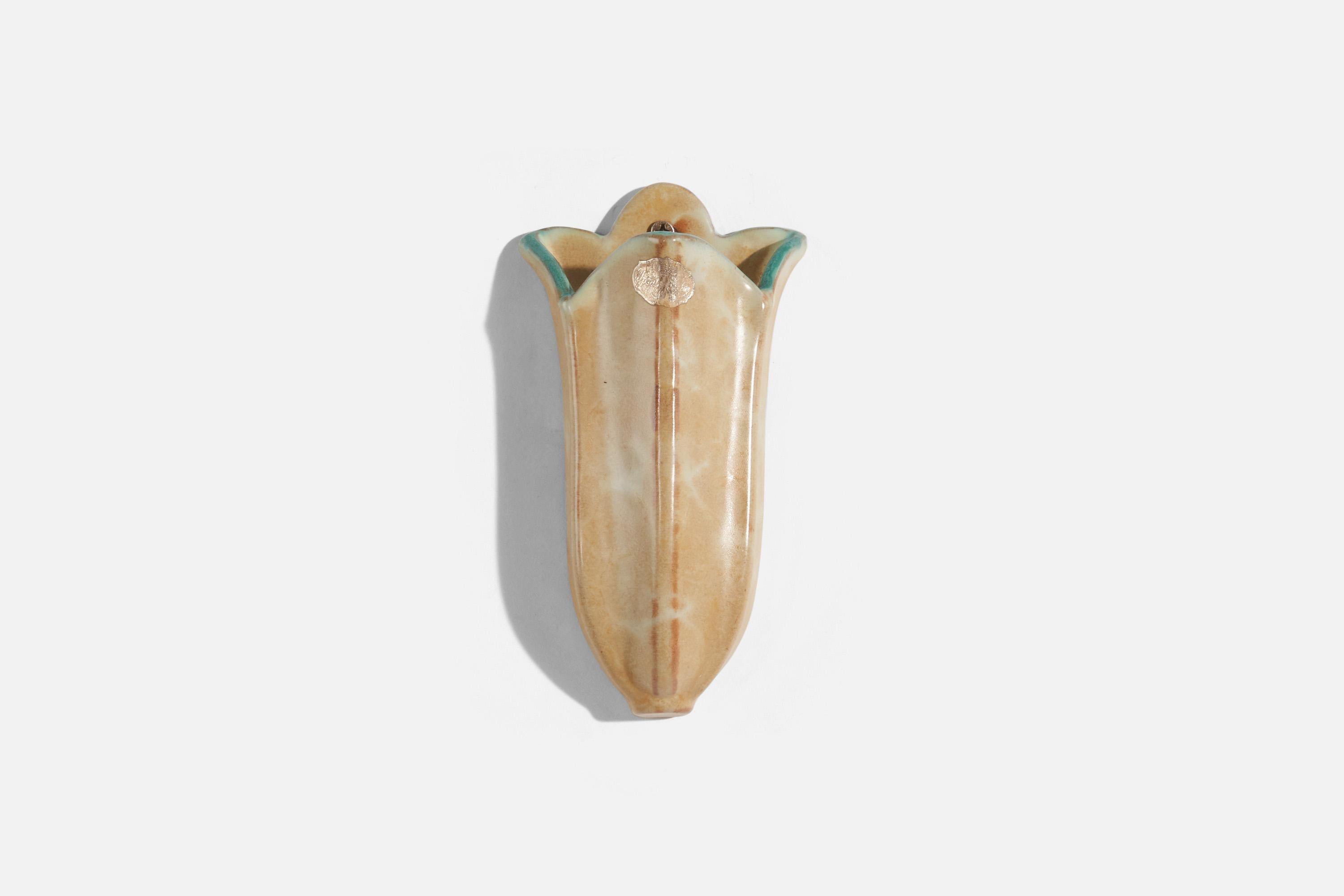 A beige and green, glazed earthenware wall plant holder designed and produced by Upsala-Ekeby, Sweden, c. 1940s.

